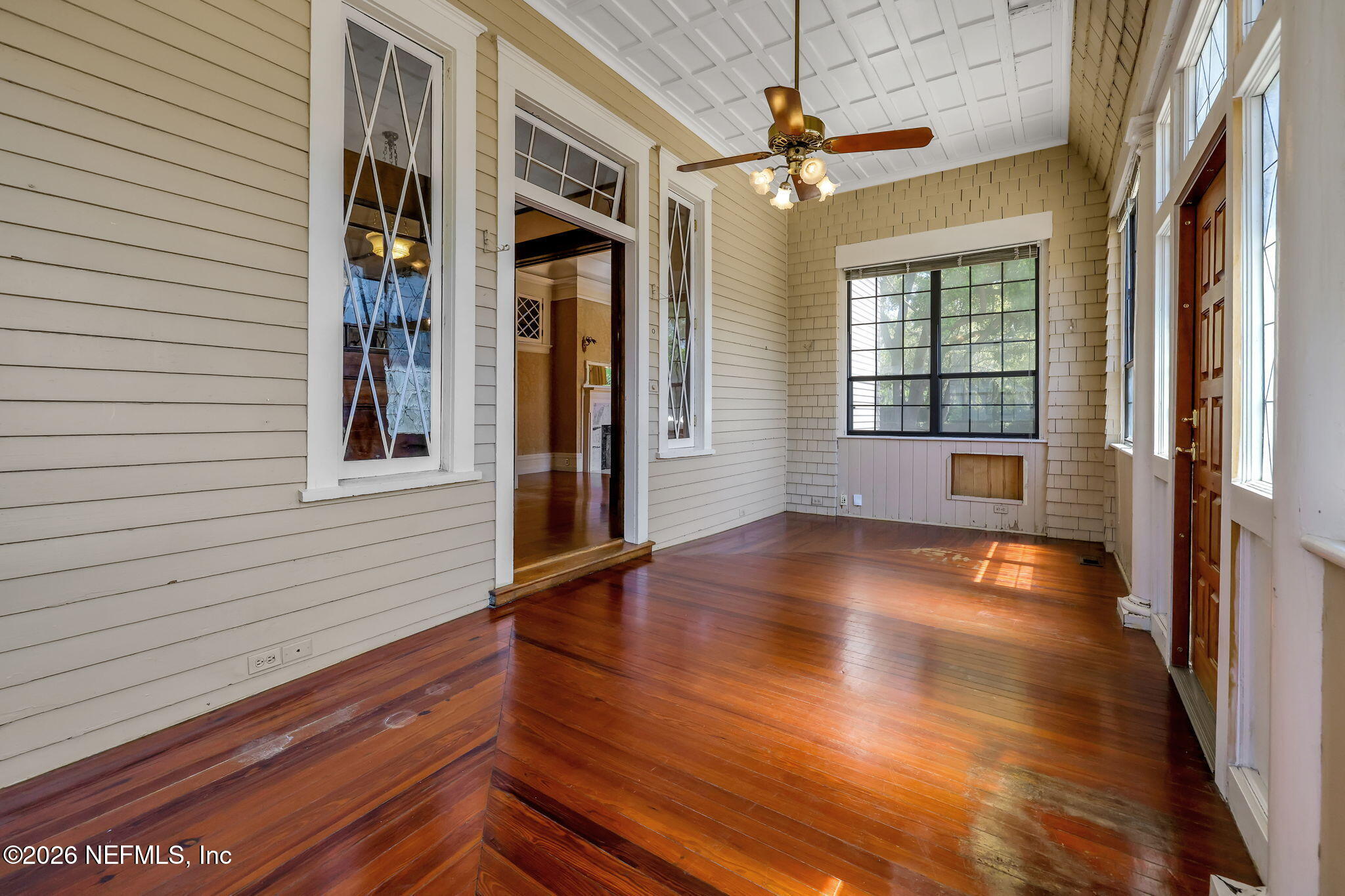 2160 Oak Street Jacksonville, FL 32204 - Photo 103 of 143 a view of a livingroom with wooden floor and a ceiling fan