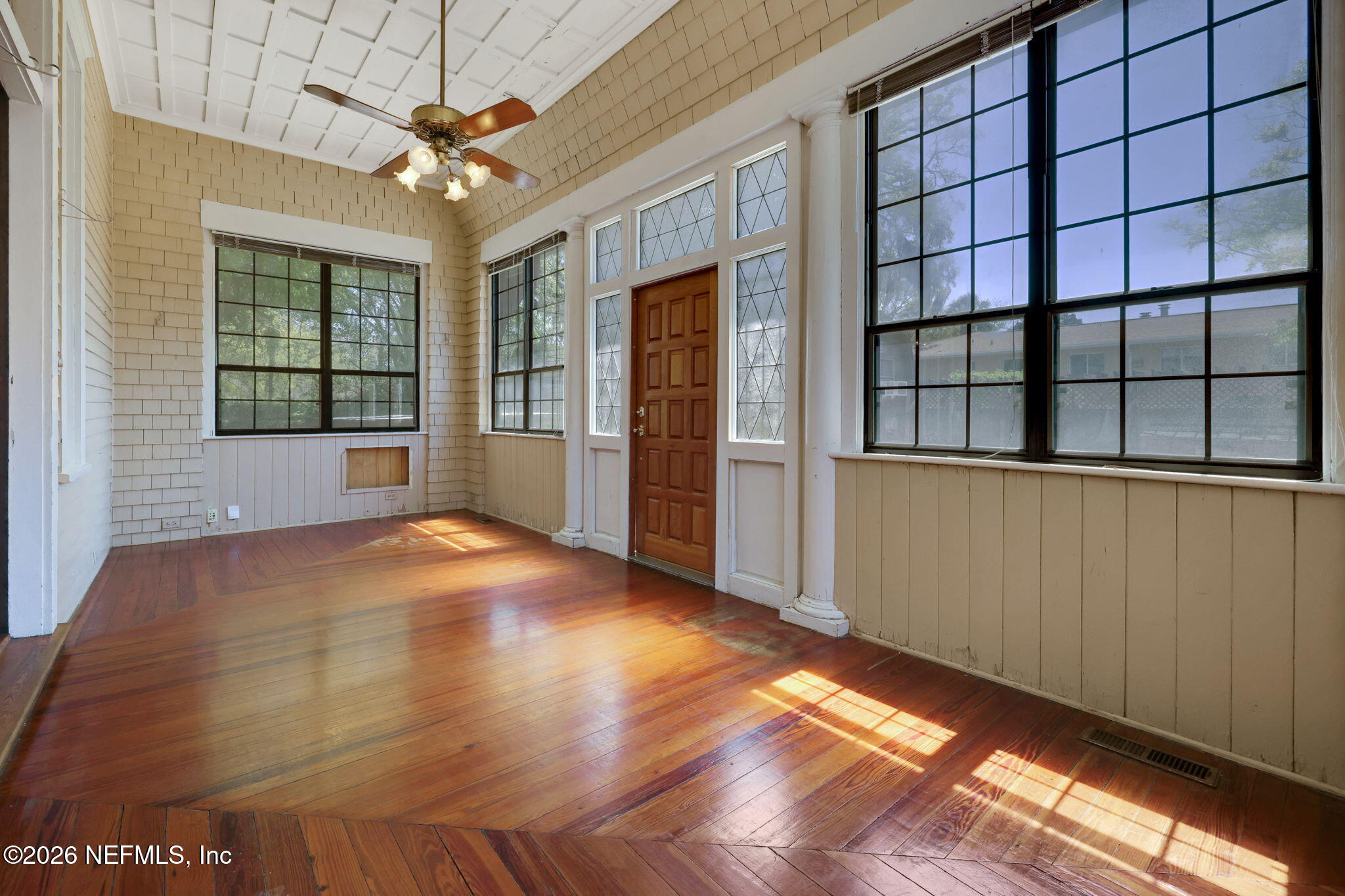 2160 Oak Street Jacksonville, FL 32204 - Photo 104 of 143 a view of an empty room with a window and wooden floor