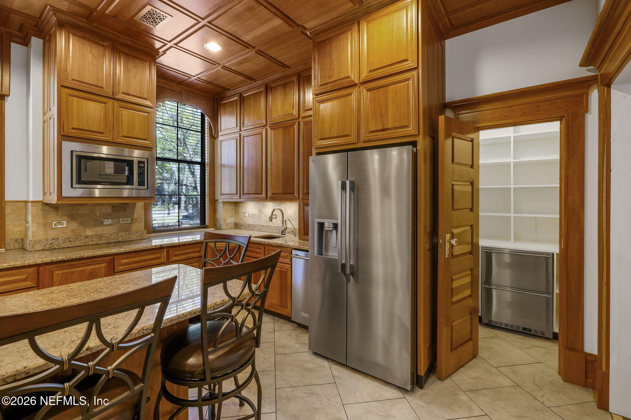 2160 Oak Street Jacksonville, FL 32204 - Photo 22 of 143 a kitchen with a refrigerator and a stove top oven