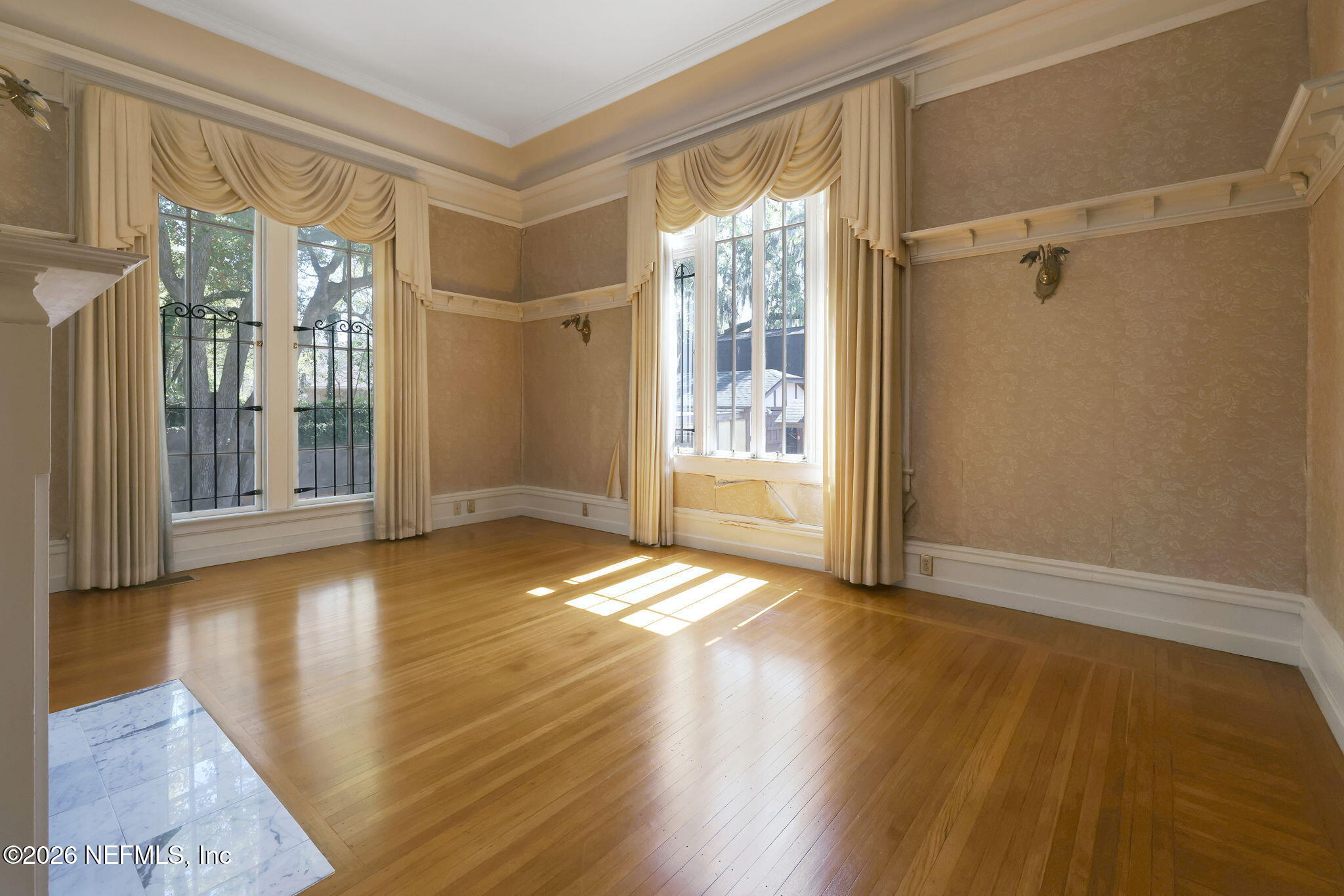 2160 Oak Street Jacksonville, FL 32204 - Photo 34 of 143 a view of an empty room with wooden floor and a window
