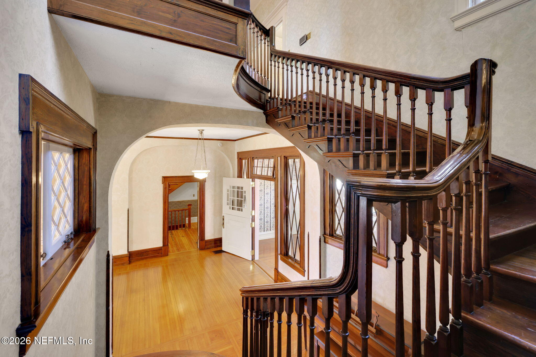 2160 Oak Street Jacksonville, FL 32204 - Photo 43 of 143 a view of staircase with a large window and wooden floor