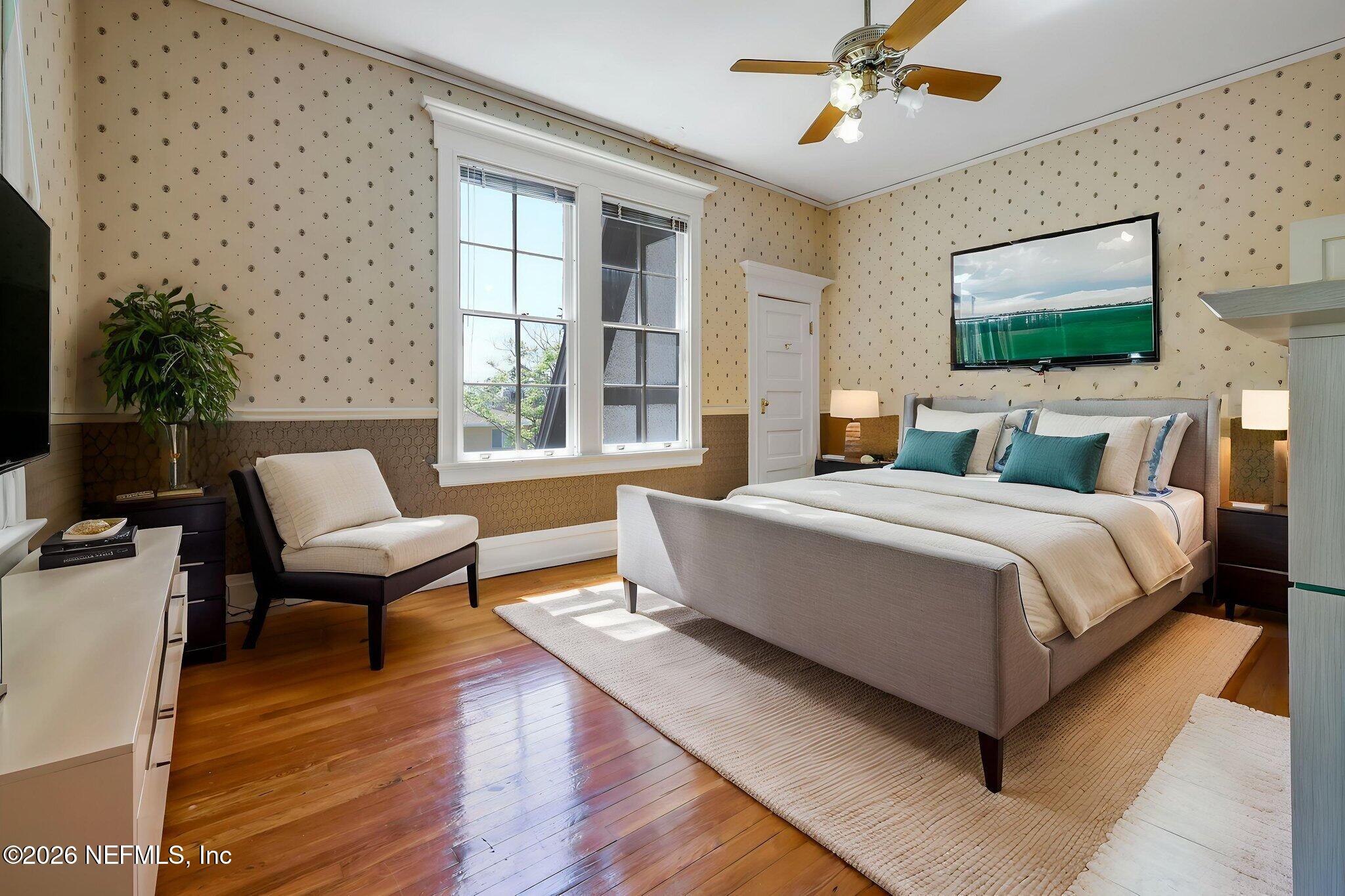2160 Oak Street Jacksonville, FL 32204 - Photo 51 of 143 a bedroom with a large bed and a flat screen tv