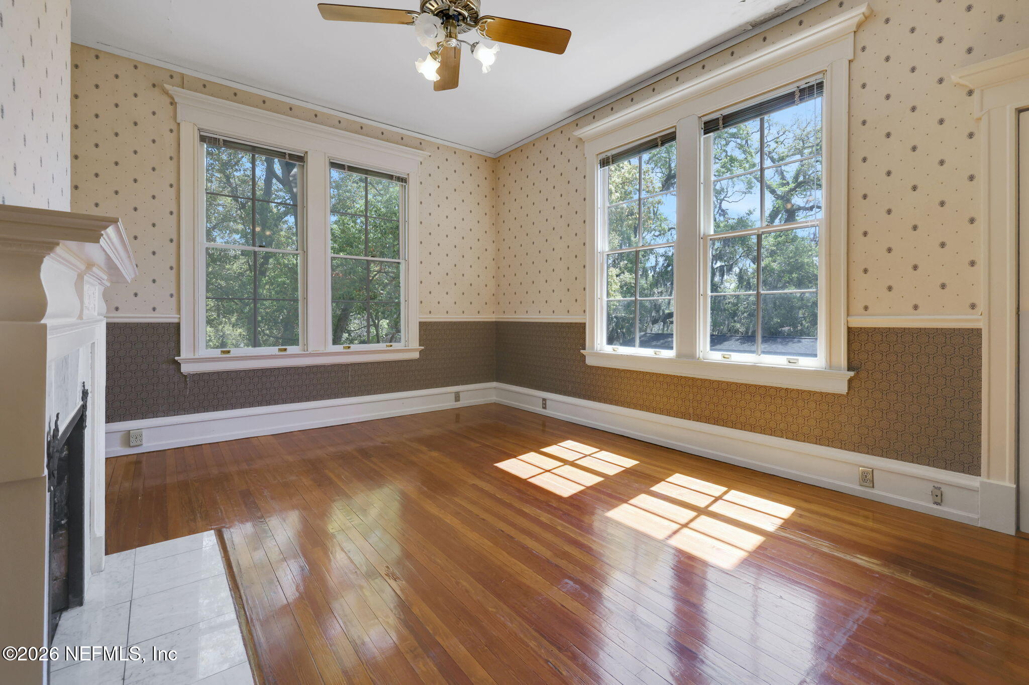 2160 Oak Street Jacksonville, FL 32204 - Photo 52 of 143 a view of an empty room with a window and wooden floor