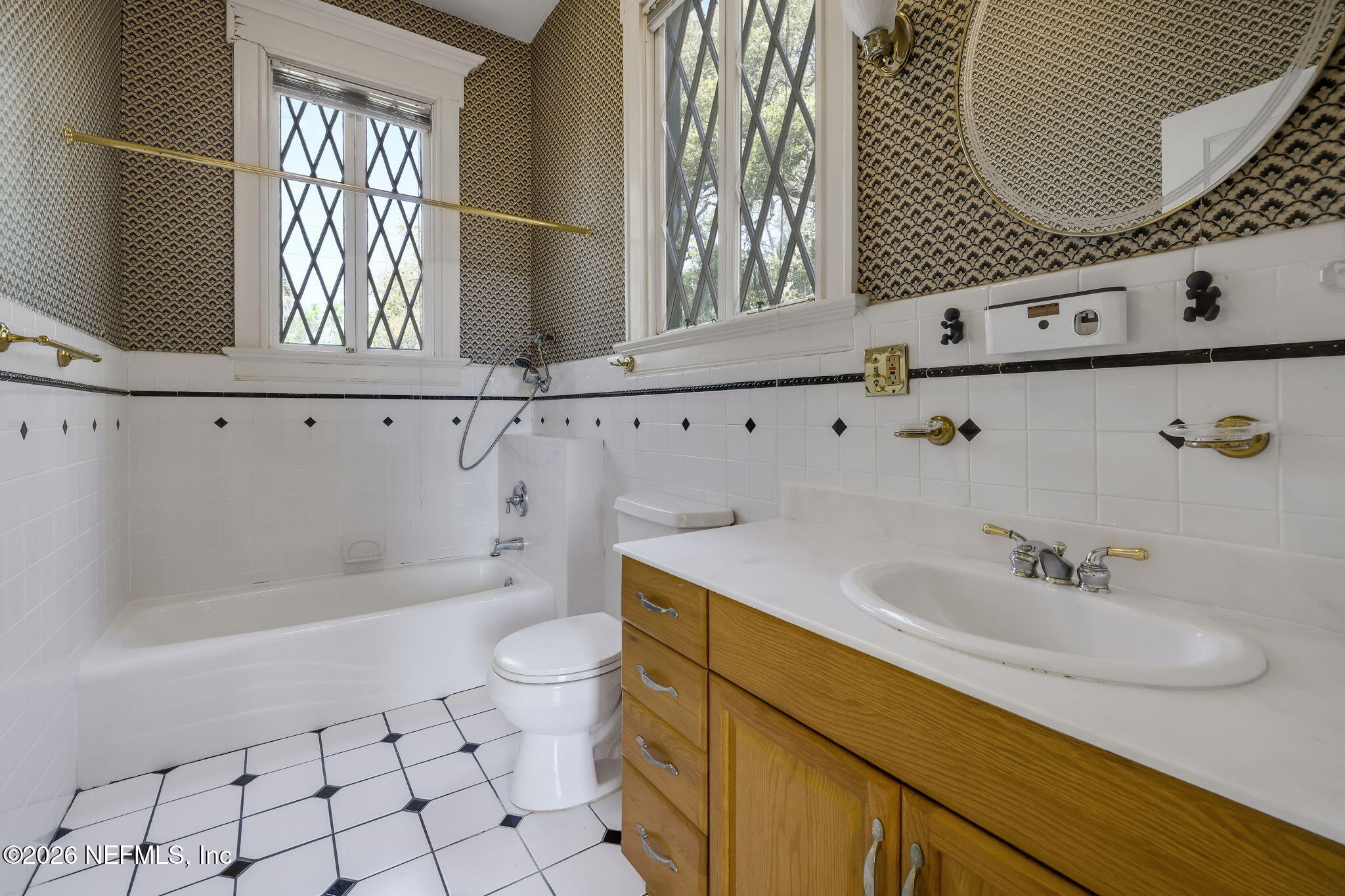 2160 Oak Street Jacksonville, FL 32204 - Photo 54 of 143 a bathroom with a sink a toilet and a mirror