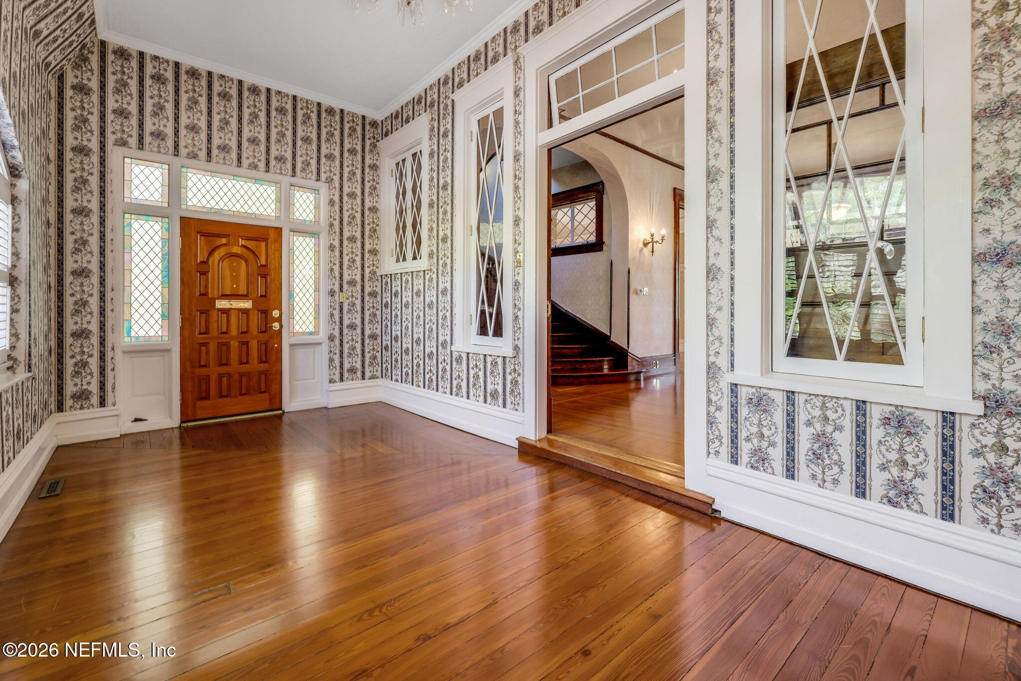 2160 Oak Street Jacksonville, FL 32204 - Photo 6 of 143 a view of an entryway with wooden floor and a front door