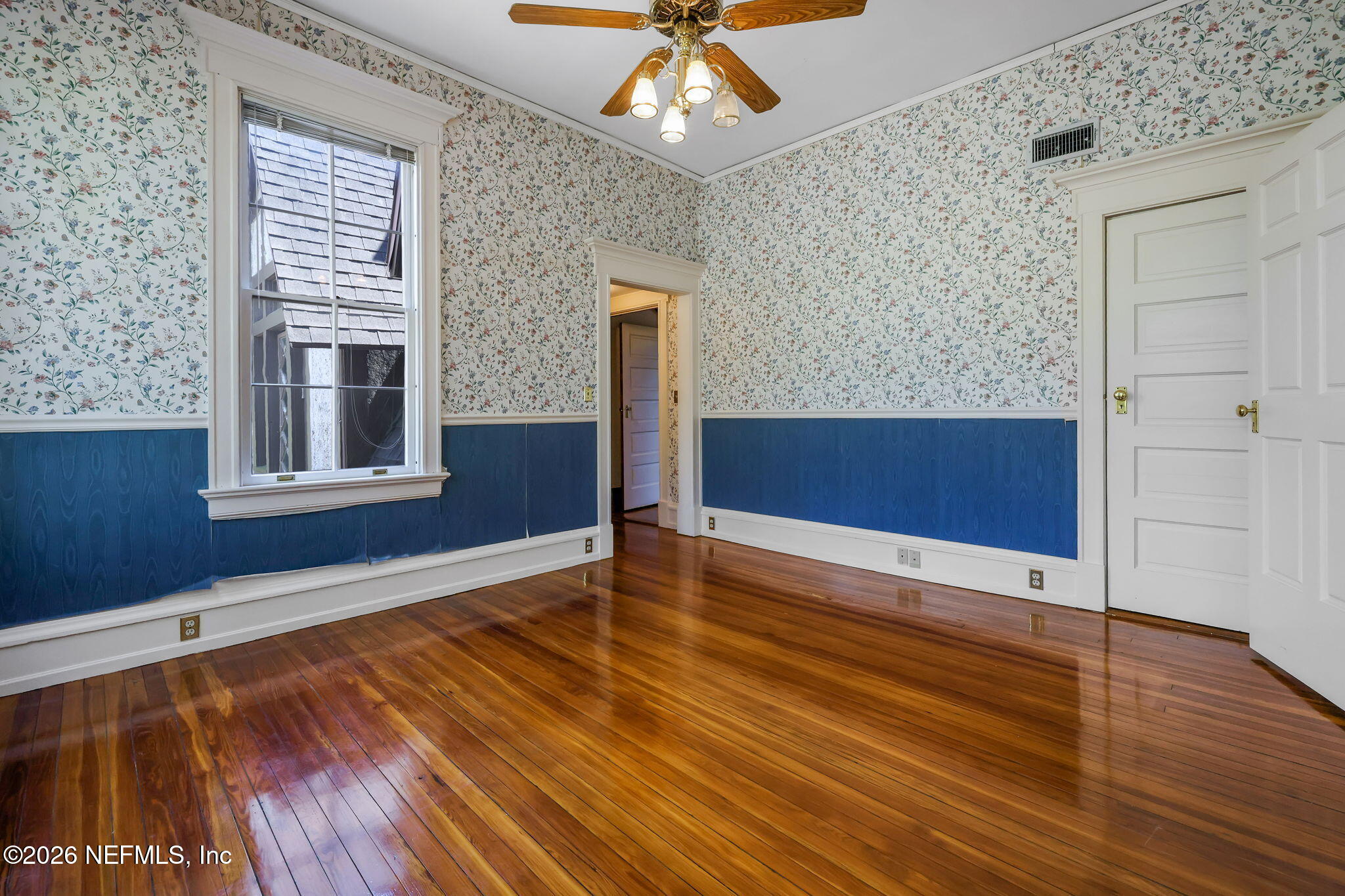 2160 Oak Street Jacksonville, FL 32204 - Photo 62 of 143 a view of an empty room with wooden floor and a window