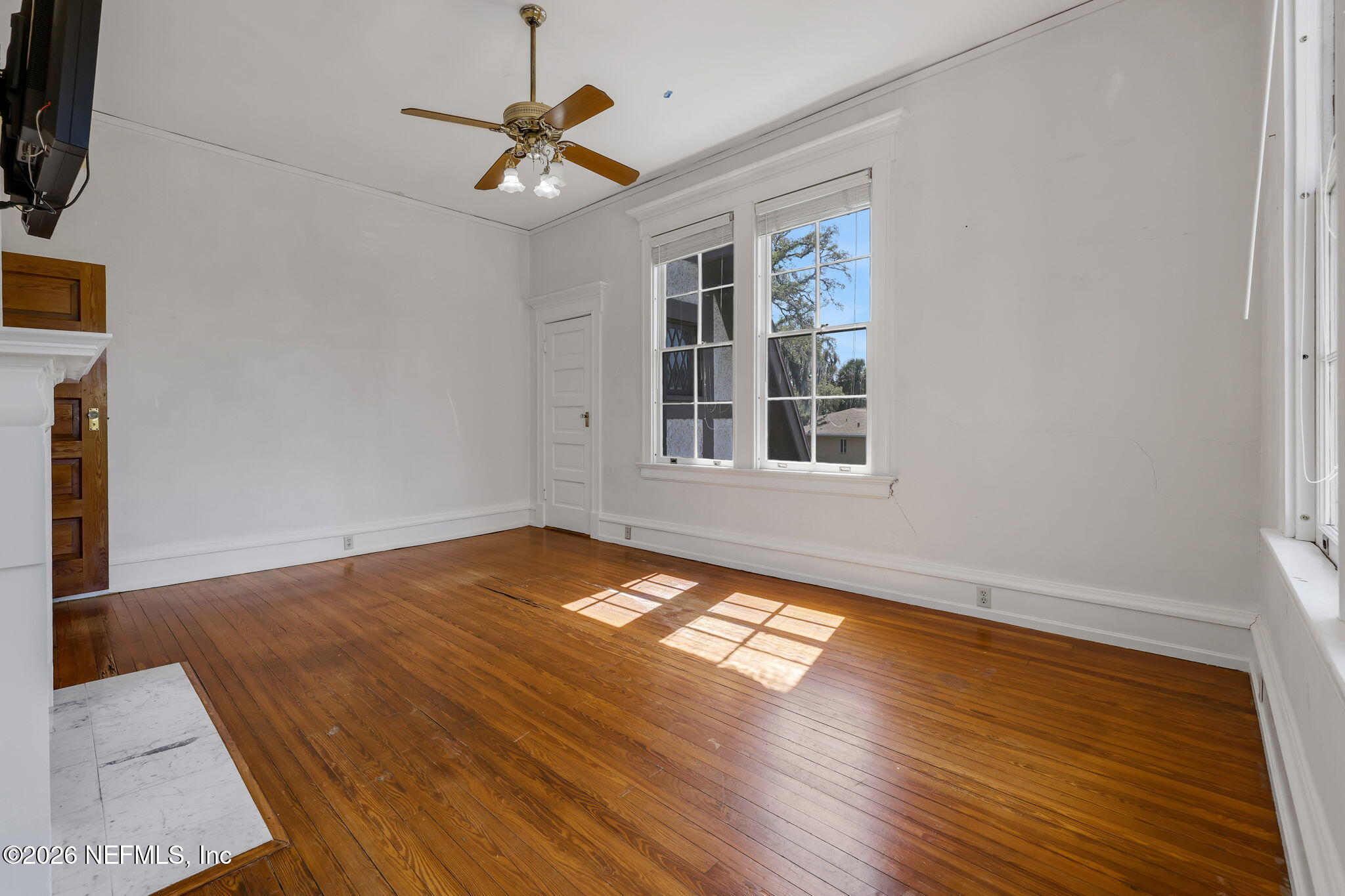 2160 Oak Street Jacksonville, FL 32204 - Photo 68 of 143 a view of an empty room with wooden floor and a window