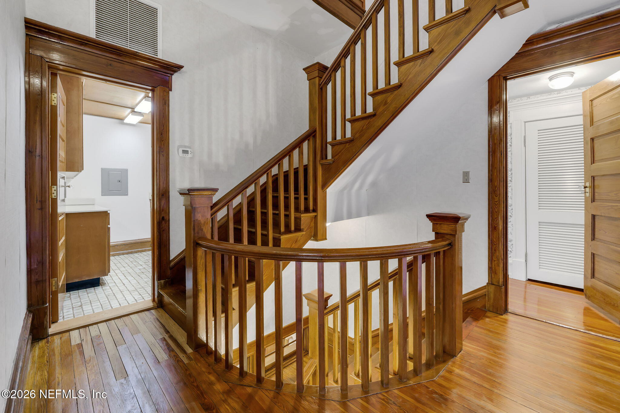 2160 Oak Street Jacksonville, FL 32204 - Photo 73 of 143 a view of staircase with wooden floor and a front door