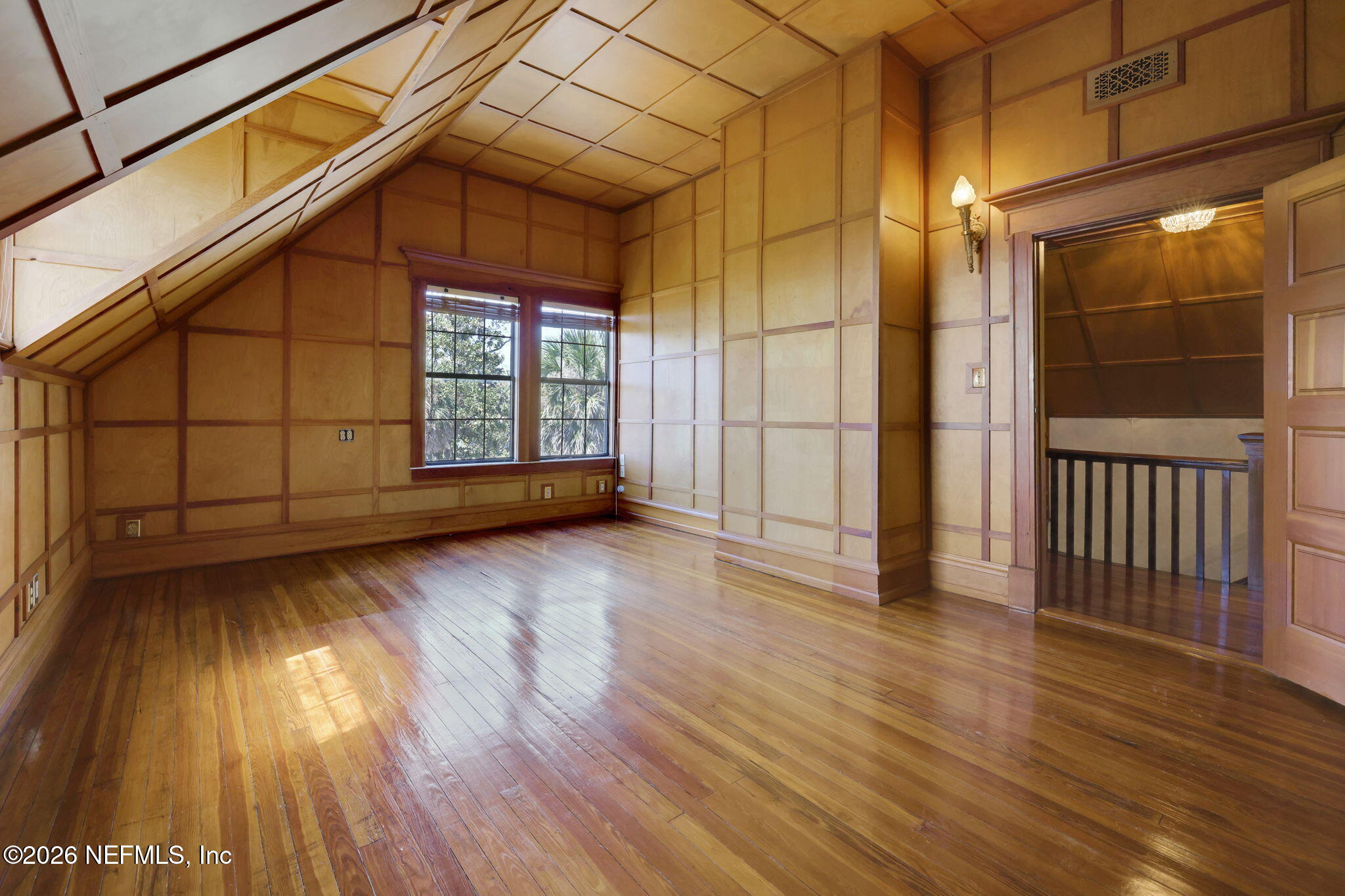 2160 Oak Street Jacksonville, FL 32204 - Photo 99 of 143 a view of an empty room with wooden floor and a window