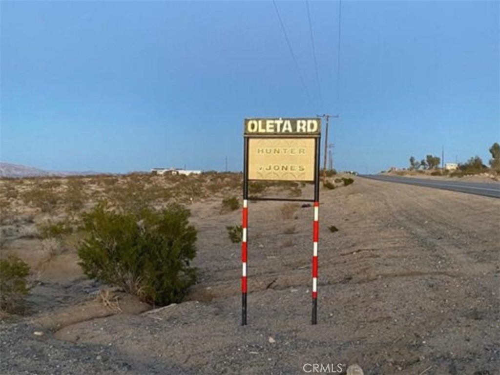 5555 Oleta Road Johnson Valley, CA 92285 - Photo 14 of 43 a street sign on a sidewalk next to a road