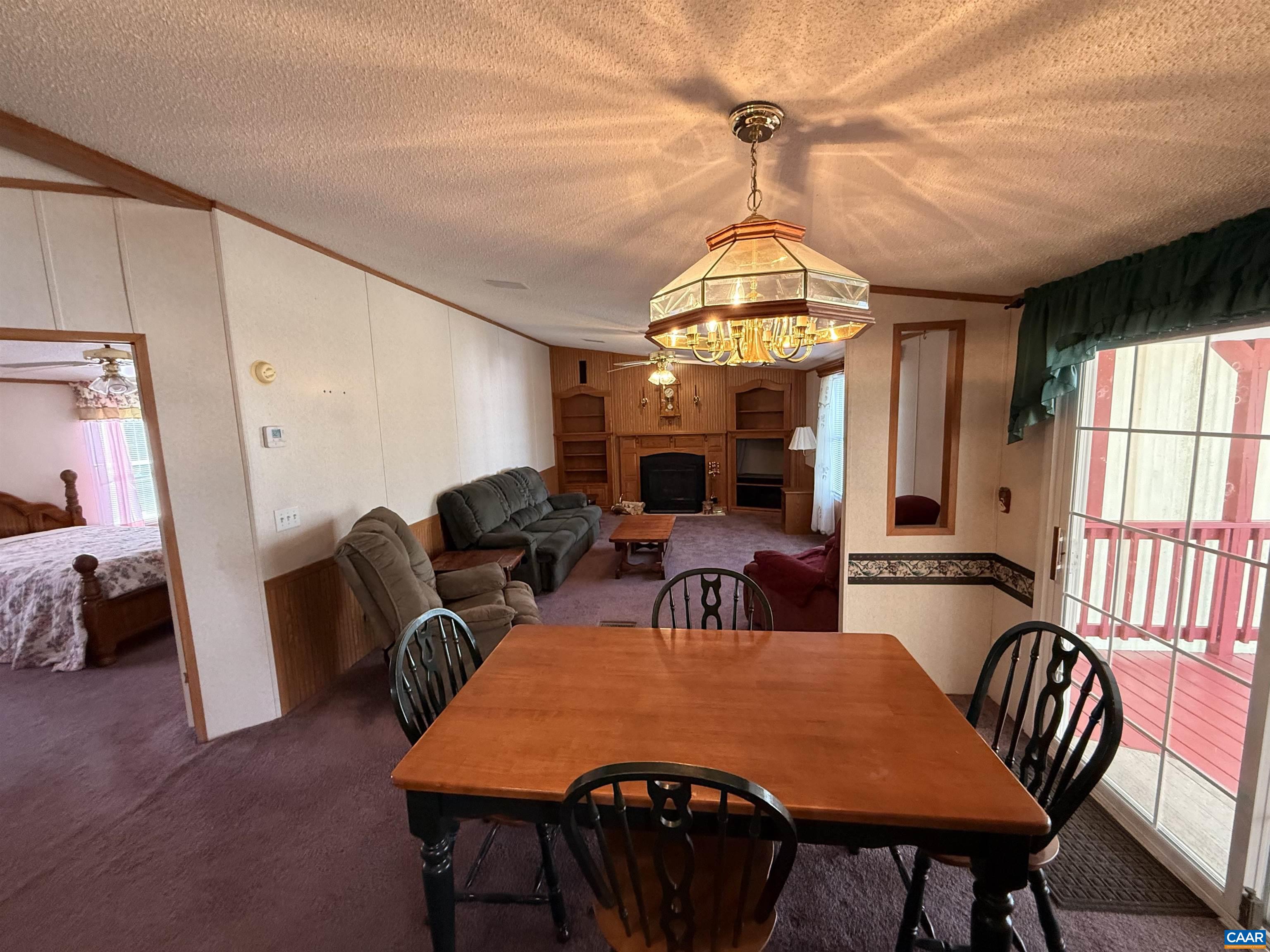 220 Chalklevel Road Louisa, VA 23093 - Photo 13 of 43 a view of a dining room with furniture window and wooden floor