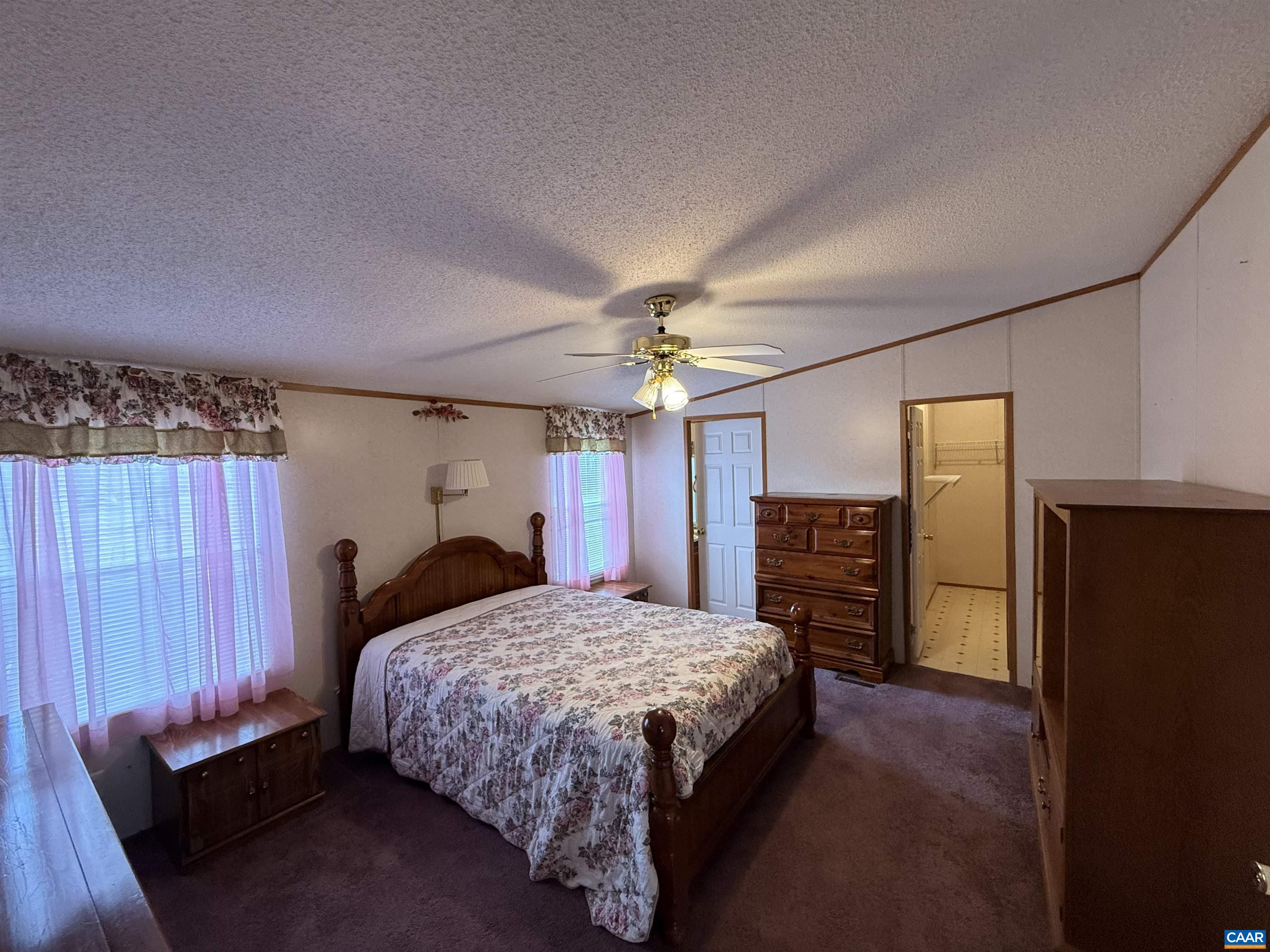 220 Chalklevel Road Louisa, VA 23093 - Photo 16 of 43 a bedroom with a bed dresser and a window
