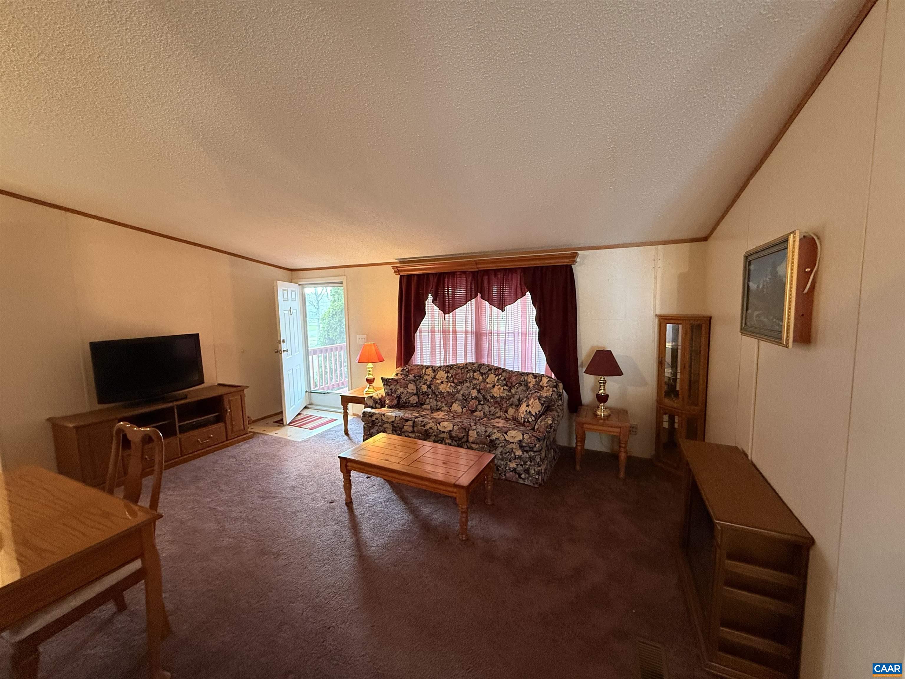 220 Chalklevel Road Louisa, VA 23093 - Photo 2 of 43 a living room with furniture and a flat screen tv