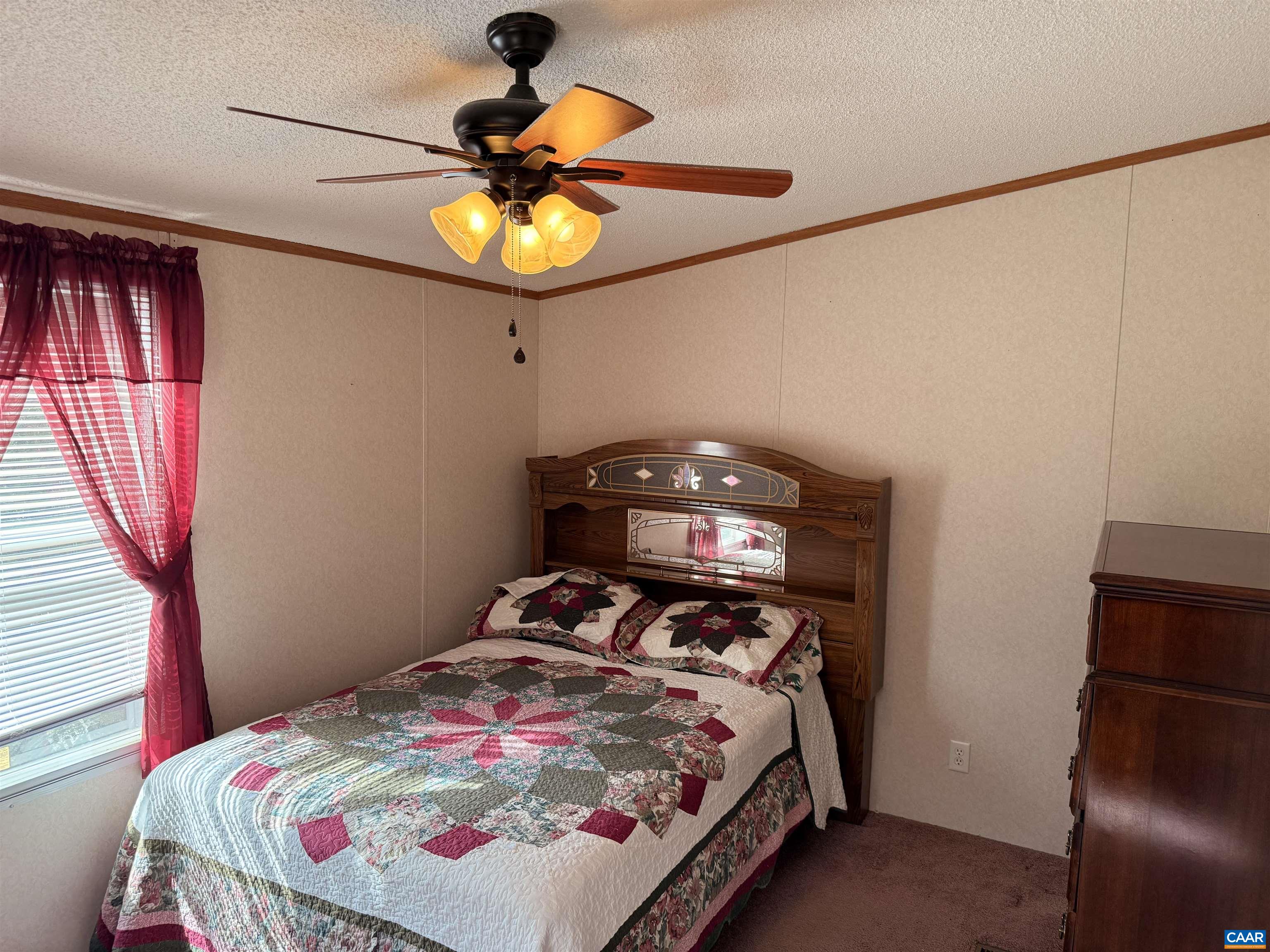 220 Chalklevel Road Louisa, VA 23093 - Photo 23 of 43 a bedroom with a bed and a chandelier
