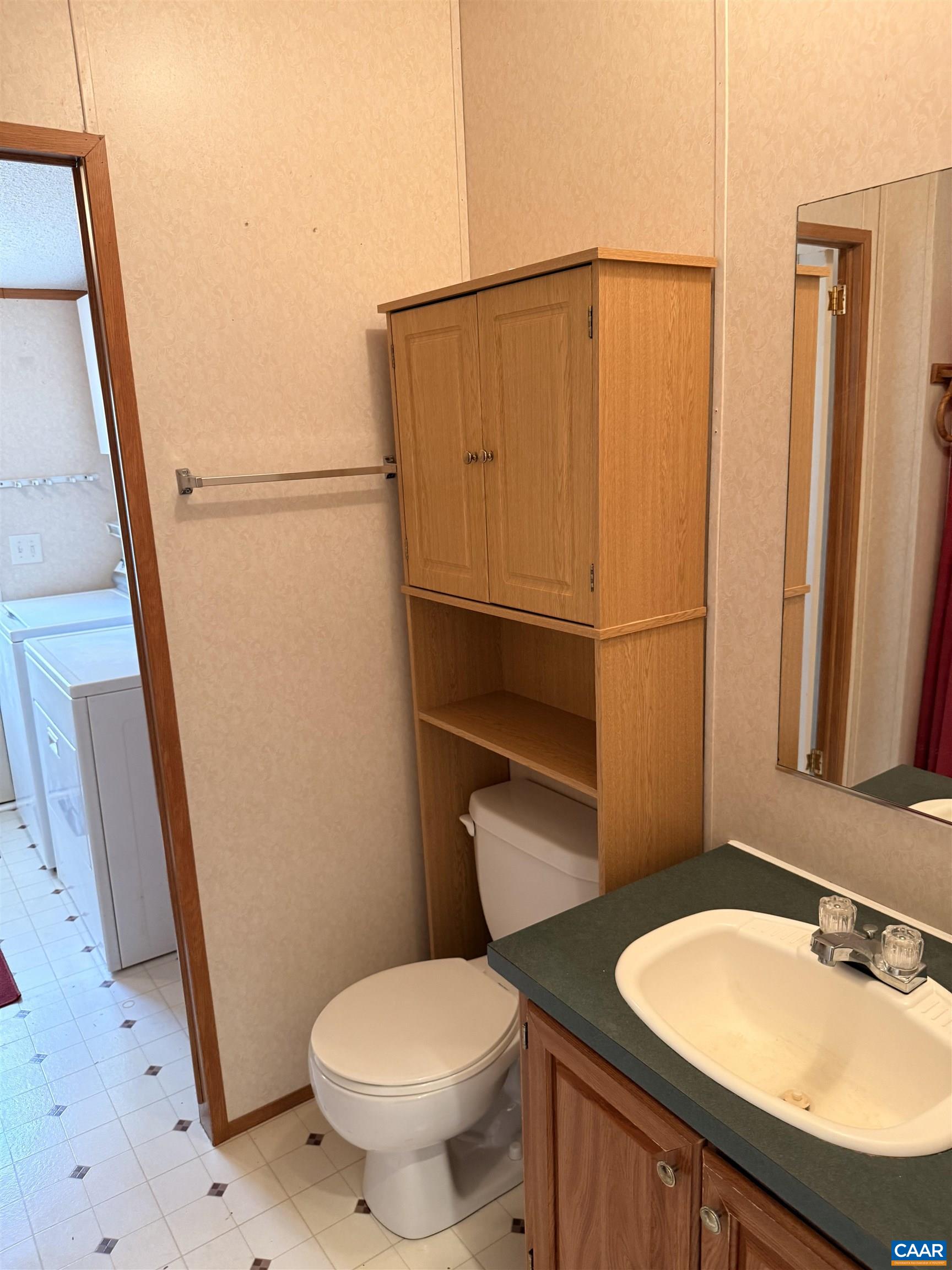 220 Chalklevel Road Louisa, VA 23093 - Photo 25 of 43 a bathroom with a sink a toilet a mirror and shower