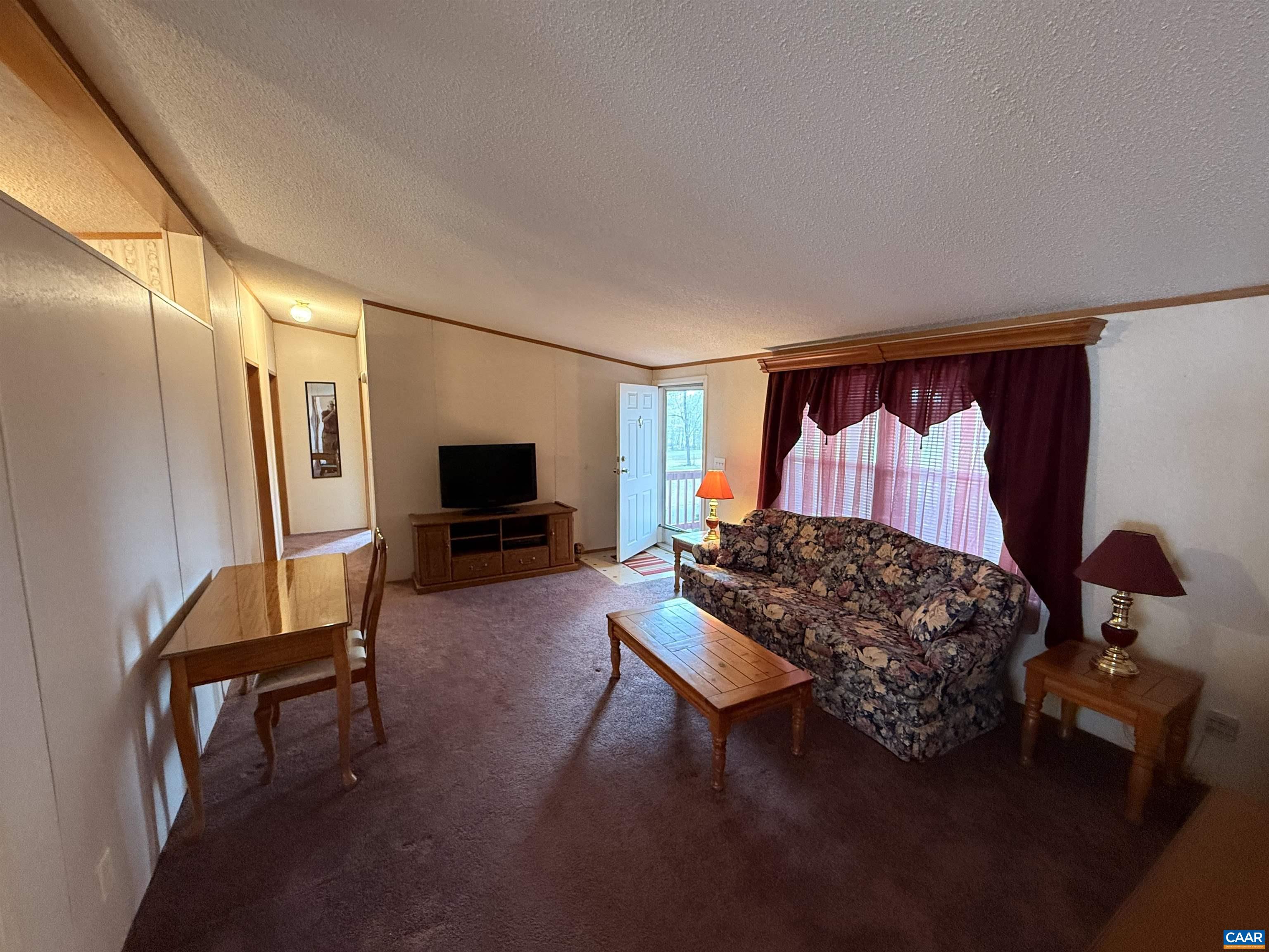 220 Chalklevel Road Louisa, VA 23093 - Photo 3 of 43 a bedroom with furniture and a flat screen tv