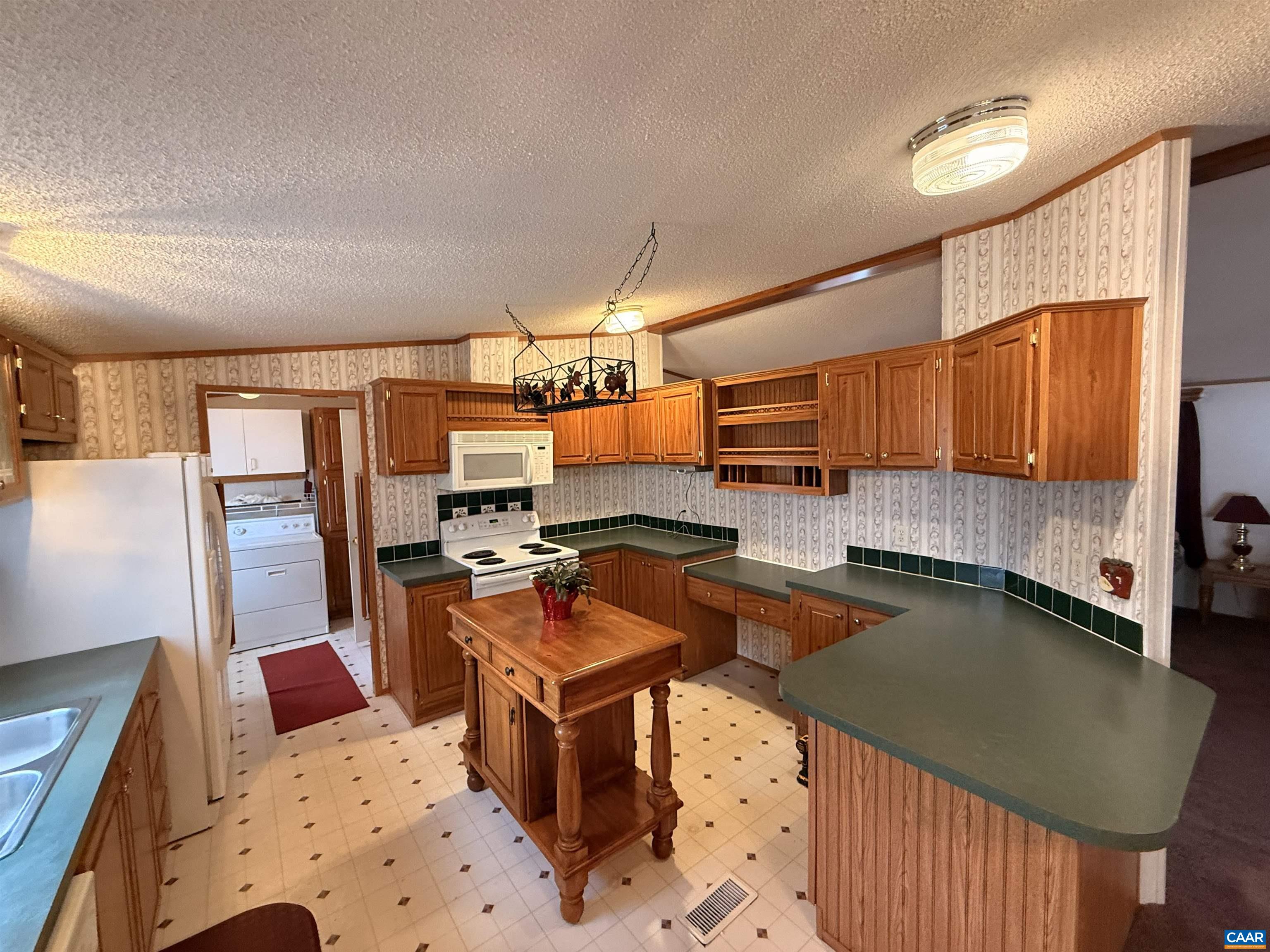 220 Chalklevel Road Louisa, VA 23093 - Photo 6 of 43 a kitchen with stainless steel appliances granite countertop a sink a stove counter space and cabinets