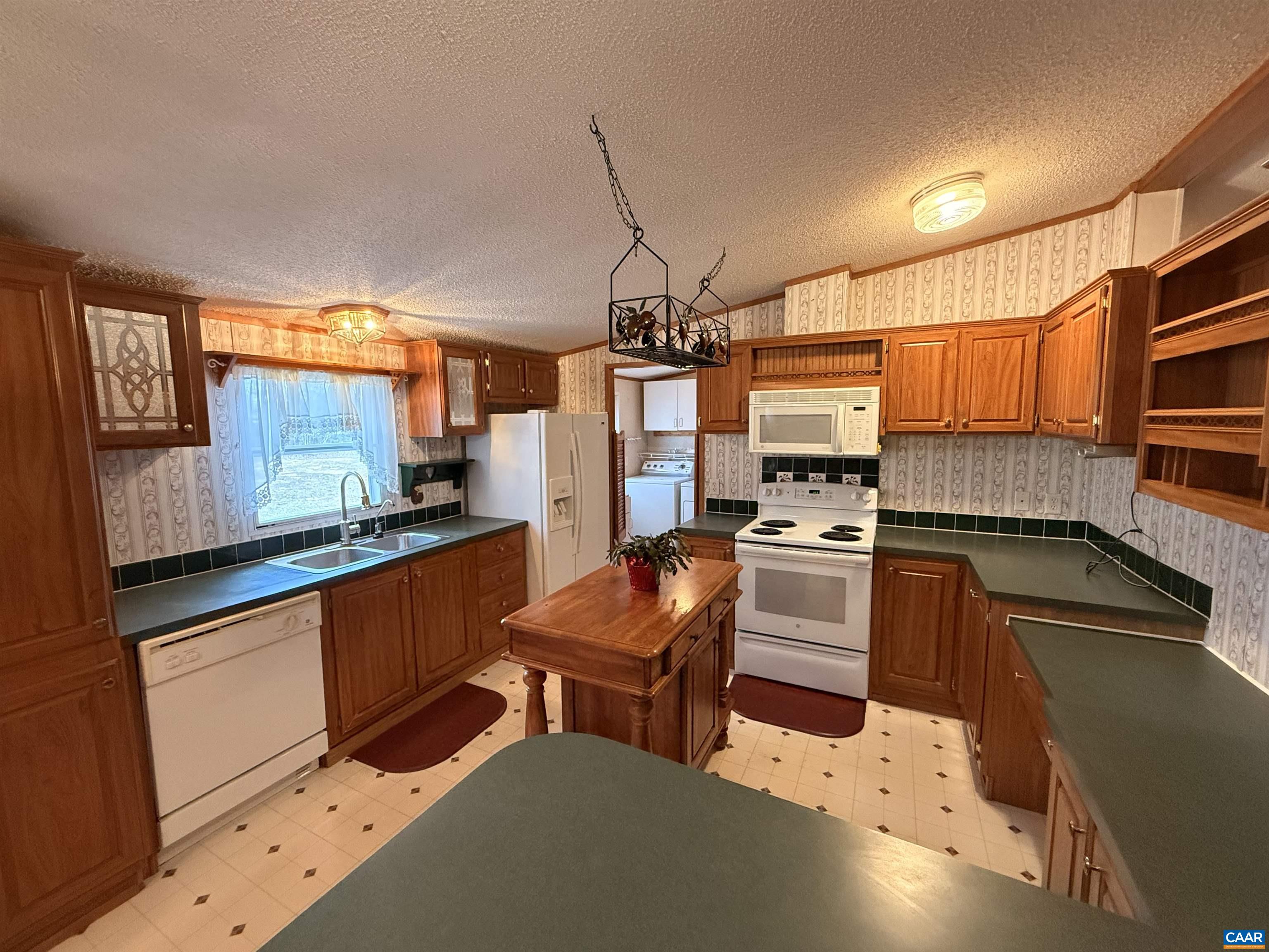 220 Chalklevel Road Louisa, VA 23093 - Photo 8 of 43 a kitchen with granite countertop a sink and counter top space