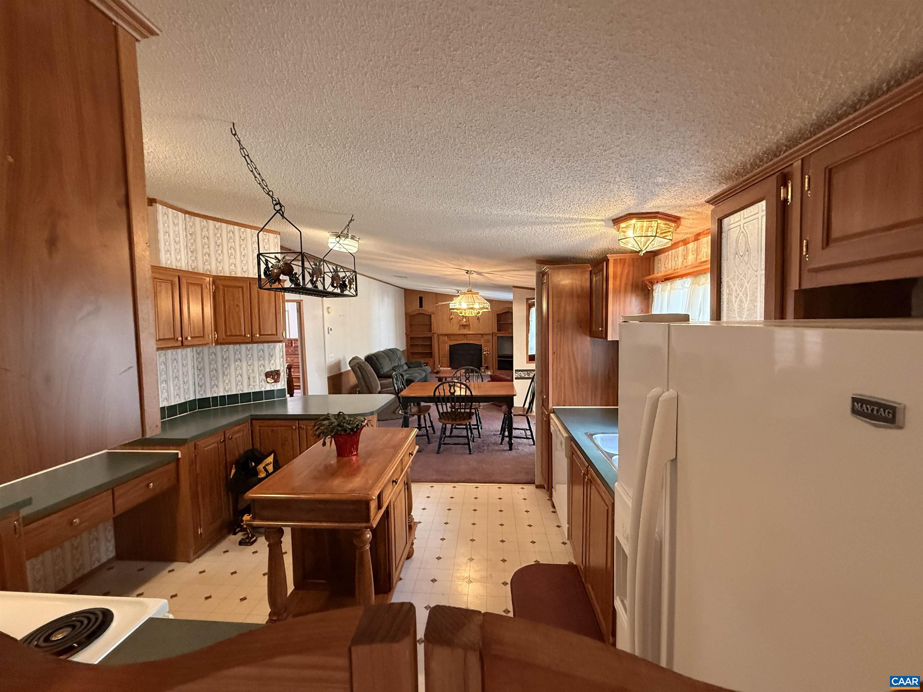 220 Chalklevel Road Louisa, VA 23093 - Photo 9 of 43 a living room with furniture a flat screen tv and a table