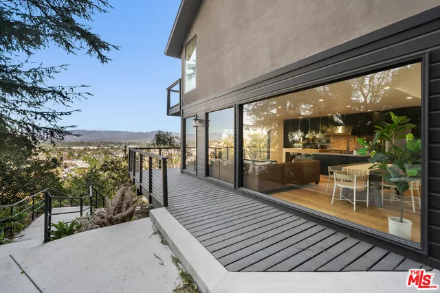 a view of a balcony with chairs
