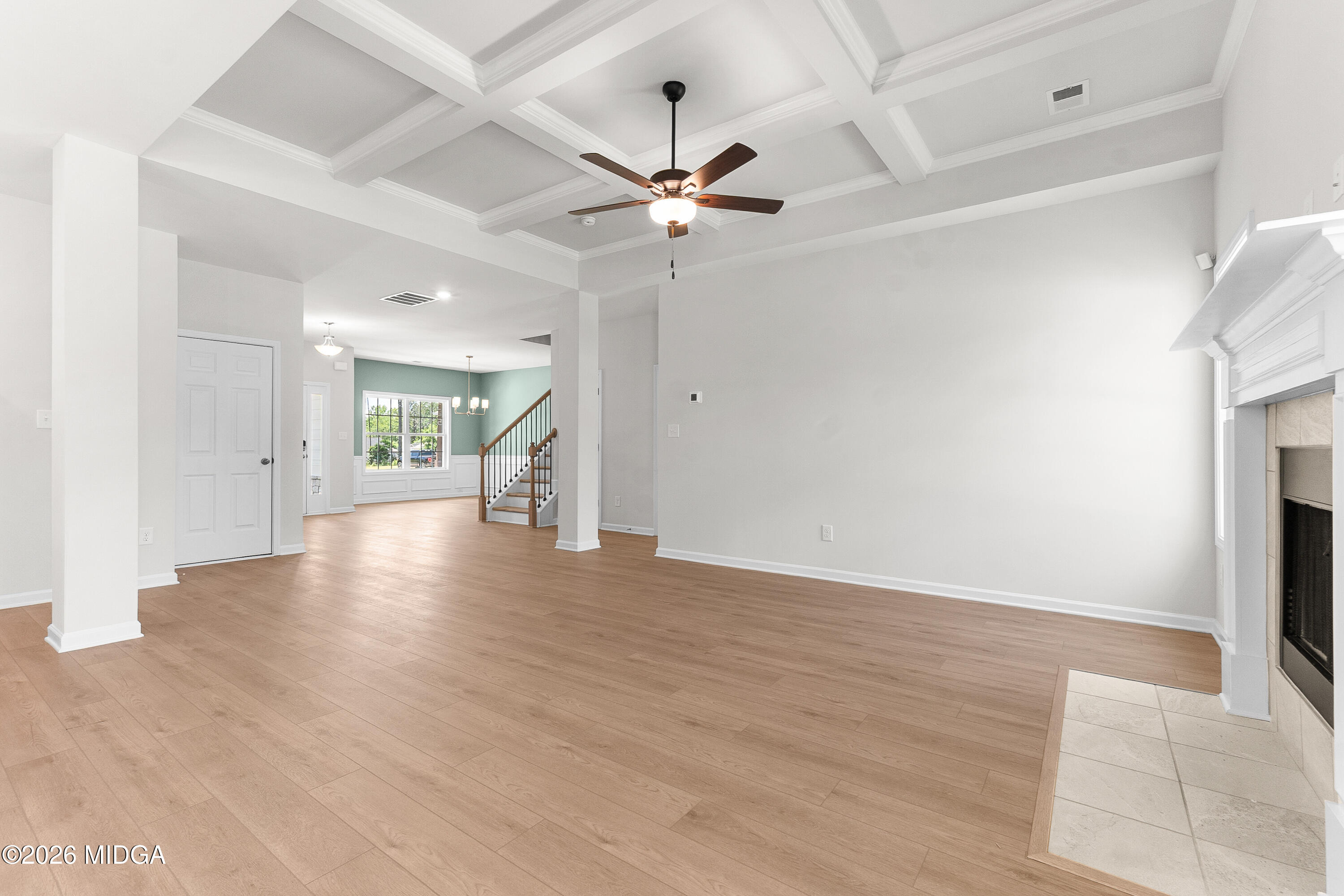 5393 Felles Way, Unit 359 Forsyth, GA 31029 - Photo 10 of 54 wooden floor in an empty room with a window