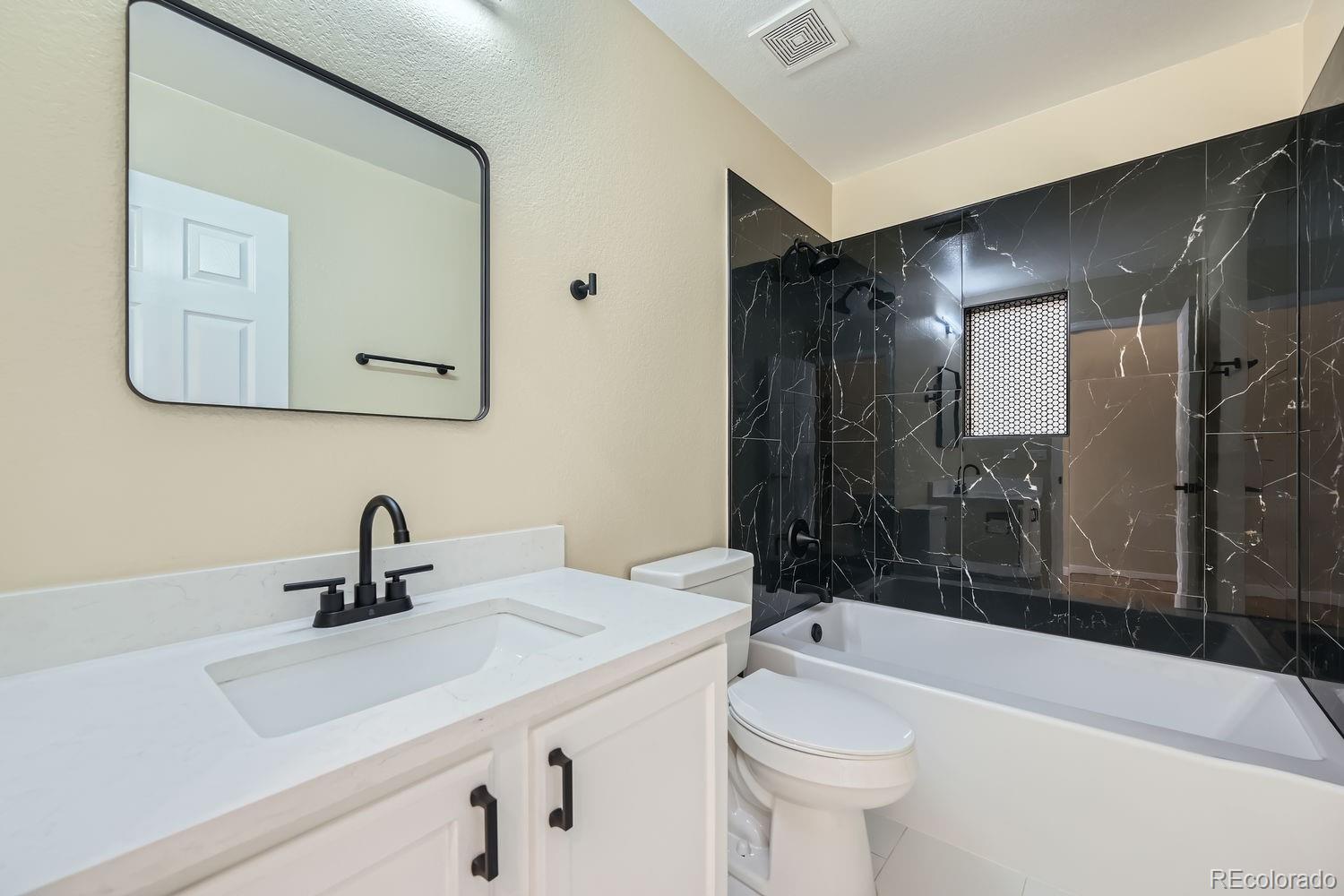 6596 Silverleaf Avenue Firestone, CO 80504 - Photo 16 of 26 a bathroom with a sink a toilet and shower