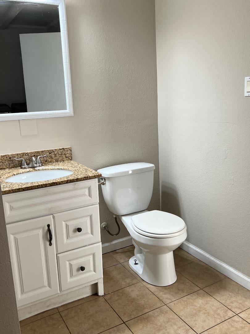 2829 Hilltop Road Concord, CA 94520 - Photo 13 of 20 a white toilet sitting next to a white sink