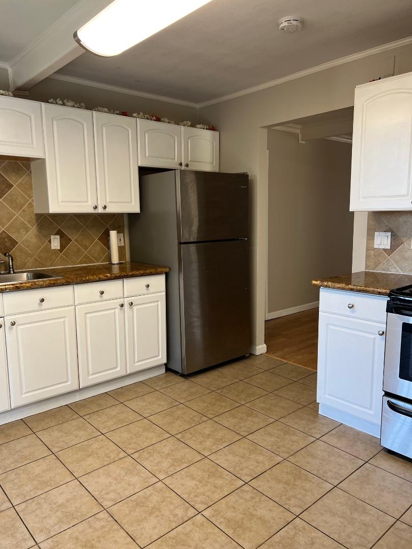 2829 Hilltop Road Concord, CA 94520 - Photo 9 of 20 a kitchen with a refrigerator sink and cabinets