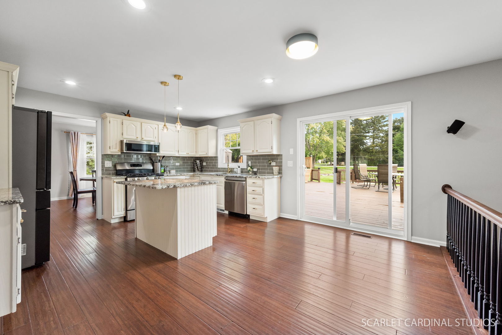 12N619 Jackson Drive Elgin, IL 60124 - Photo 13 of 50 an open kitchen with wooden floor and stainless steel appliances