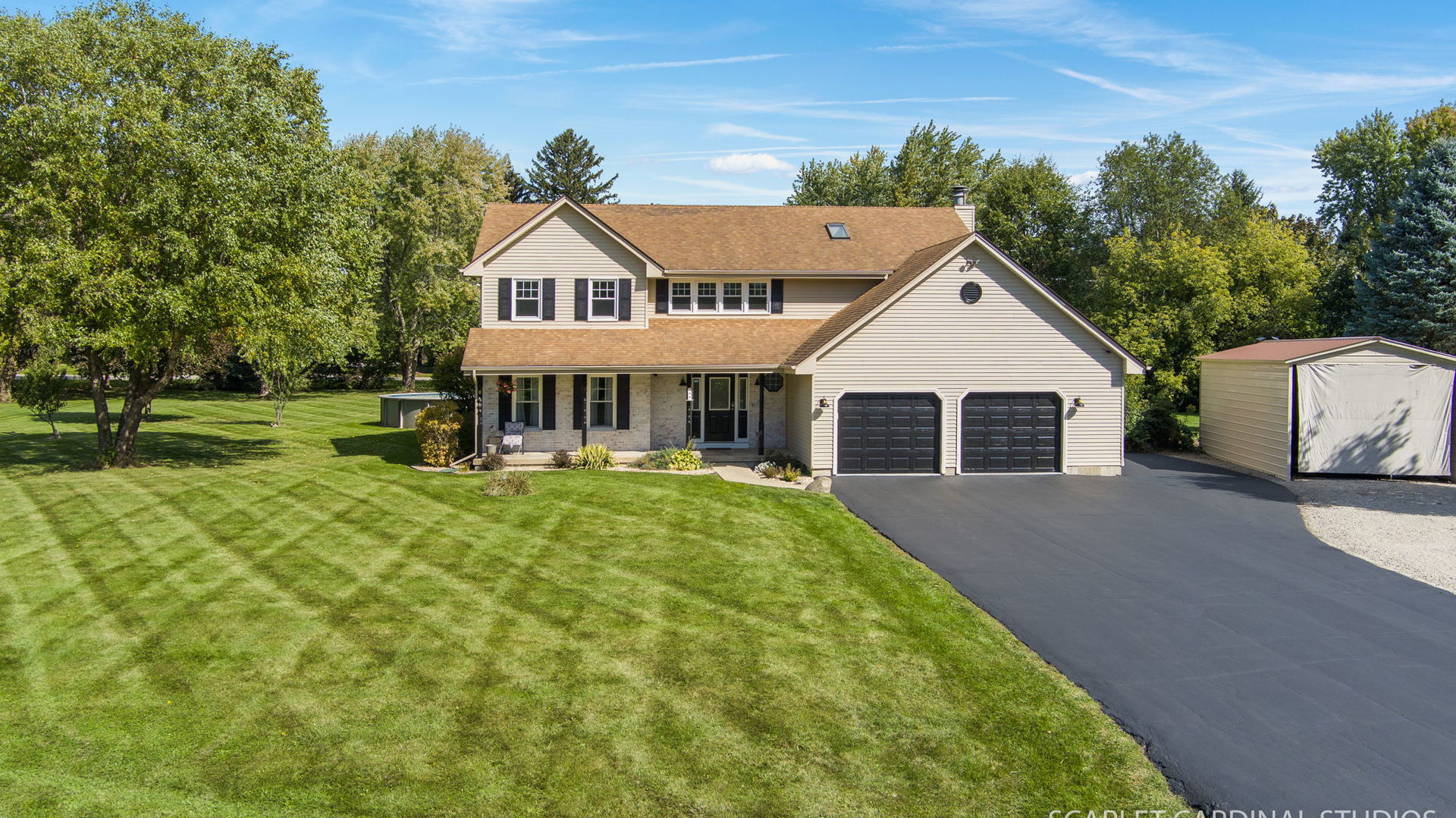 12N619 Jackson Drive Elgin, IL 60124 - Photo 3 of 50 a view of a house with a yard and fence