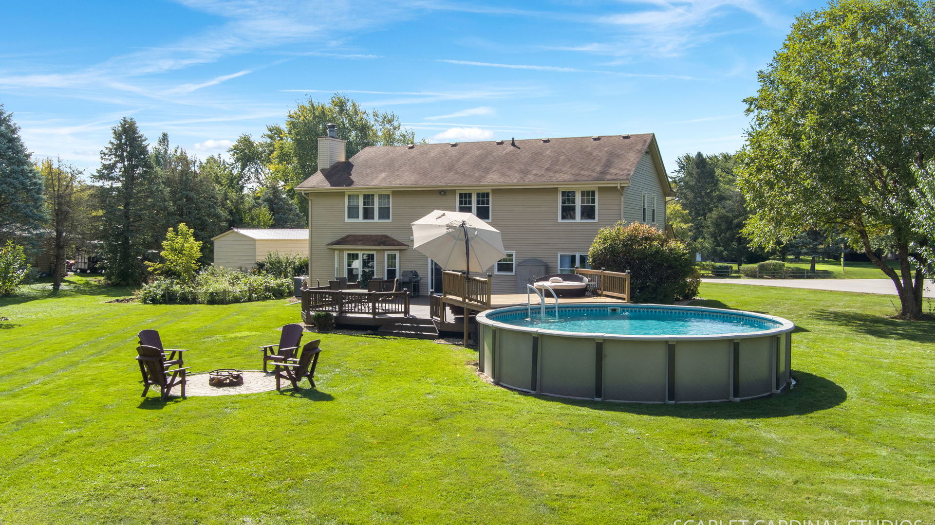 12N619 Jackson Drive Elgin, IL 60124 - Photo 40 of 50 a view of a house with swimming pool and sitting area