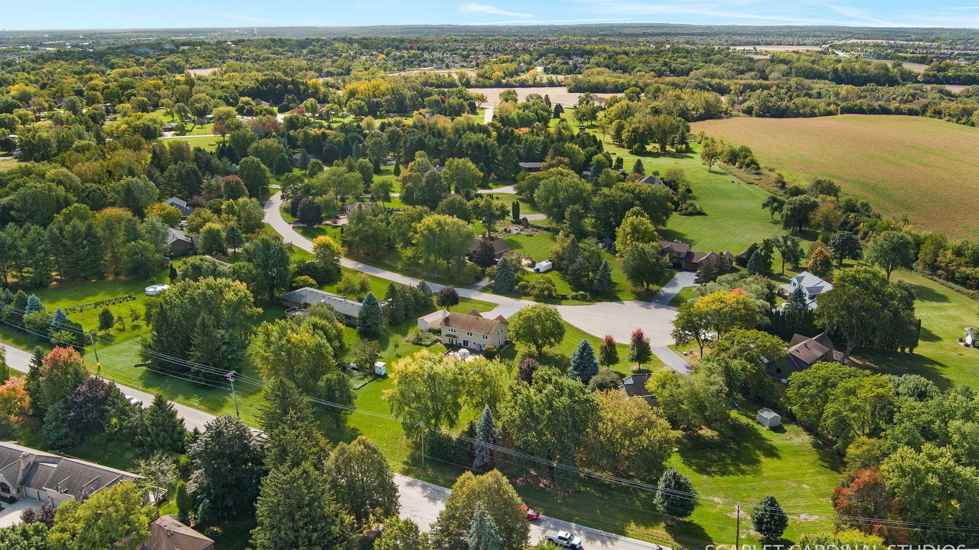 12N619 Jackson Drive Elgin, IL 60124 - Photo 49 of 50 an aerial view of residential houses with outdoor space and trees