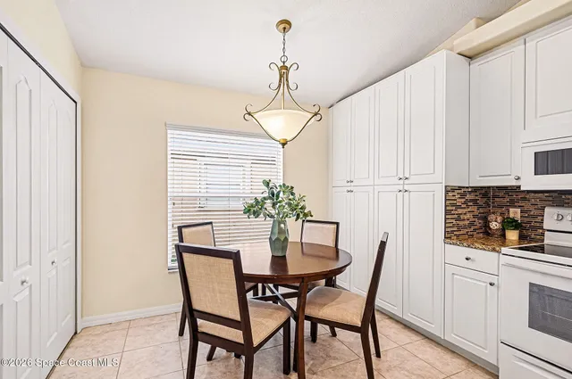 a work room with furniture and a window