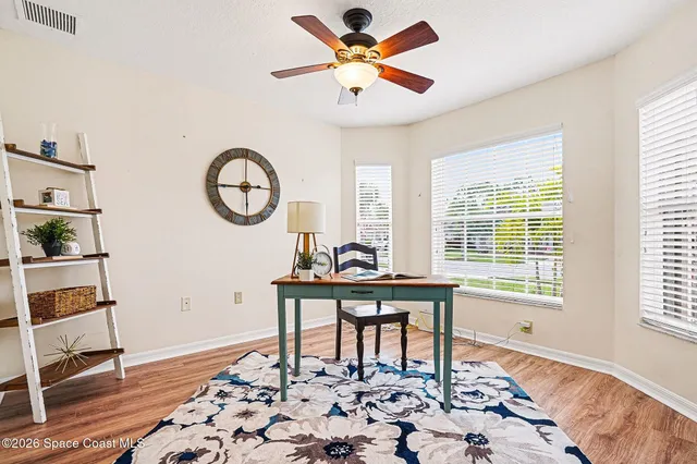 a en suite bathroom with a sink a mirror and next to a window