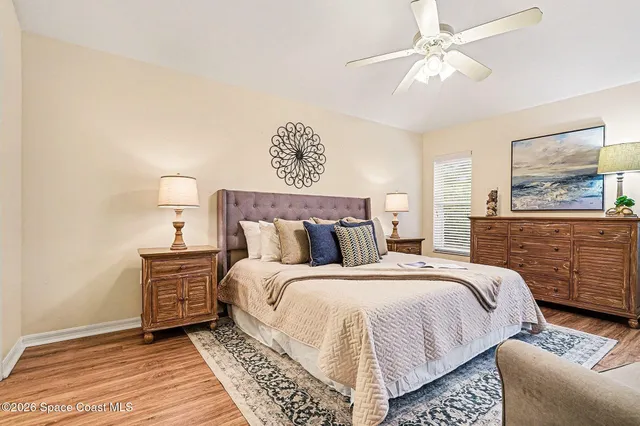 a bathroom with a double vanity sink a mirror and a toilet