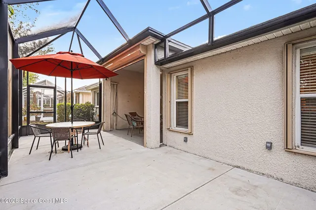 a view of a building with outdoor seating