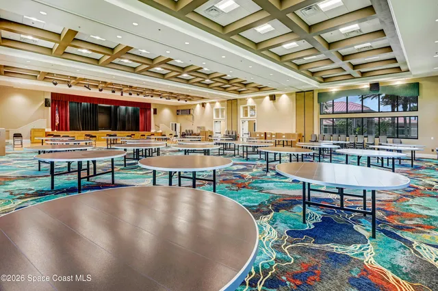 a view of a dining room with furniture and window