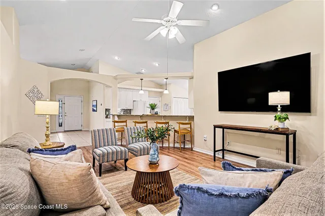 a living room with furniture and a flat screen tv