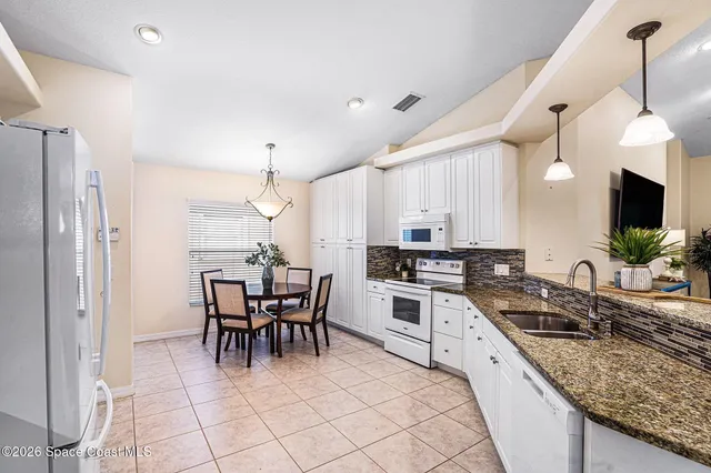 a dining room that has a dining table and chair