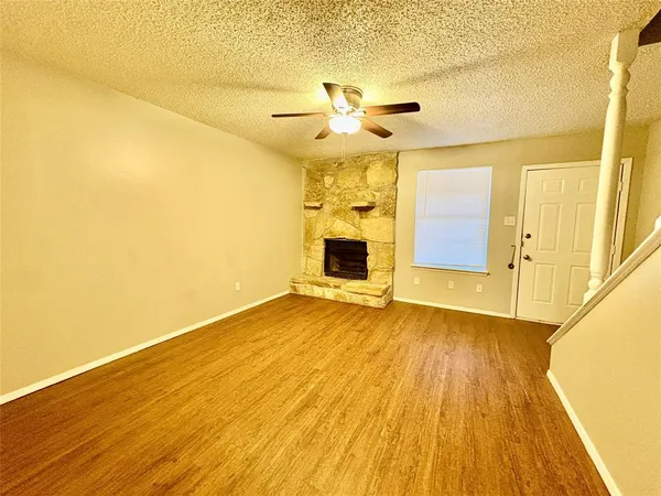 a kitchen with stainless steel appliances granite countertop a refrigerator a stove a sink and a microwave