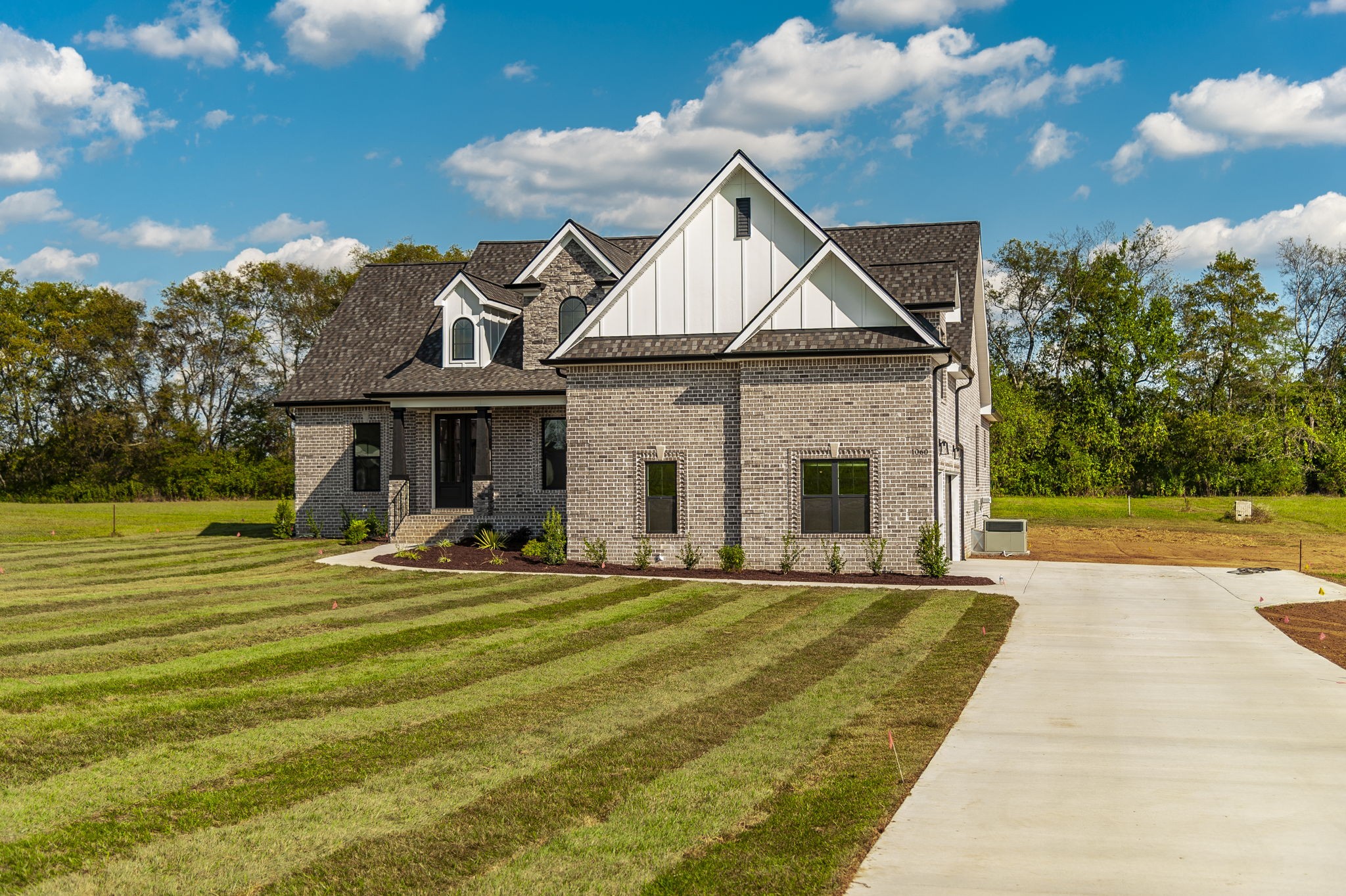 1060 Millbrook Way Gallatin, TN 37066 - Photo 2 of 79 a front view of a house with a yard