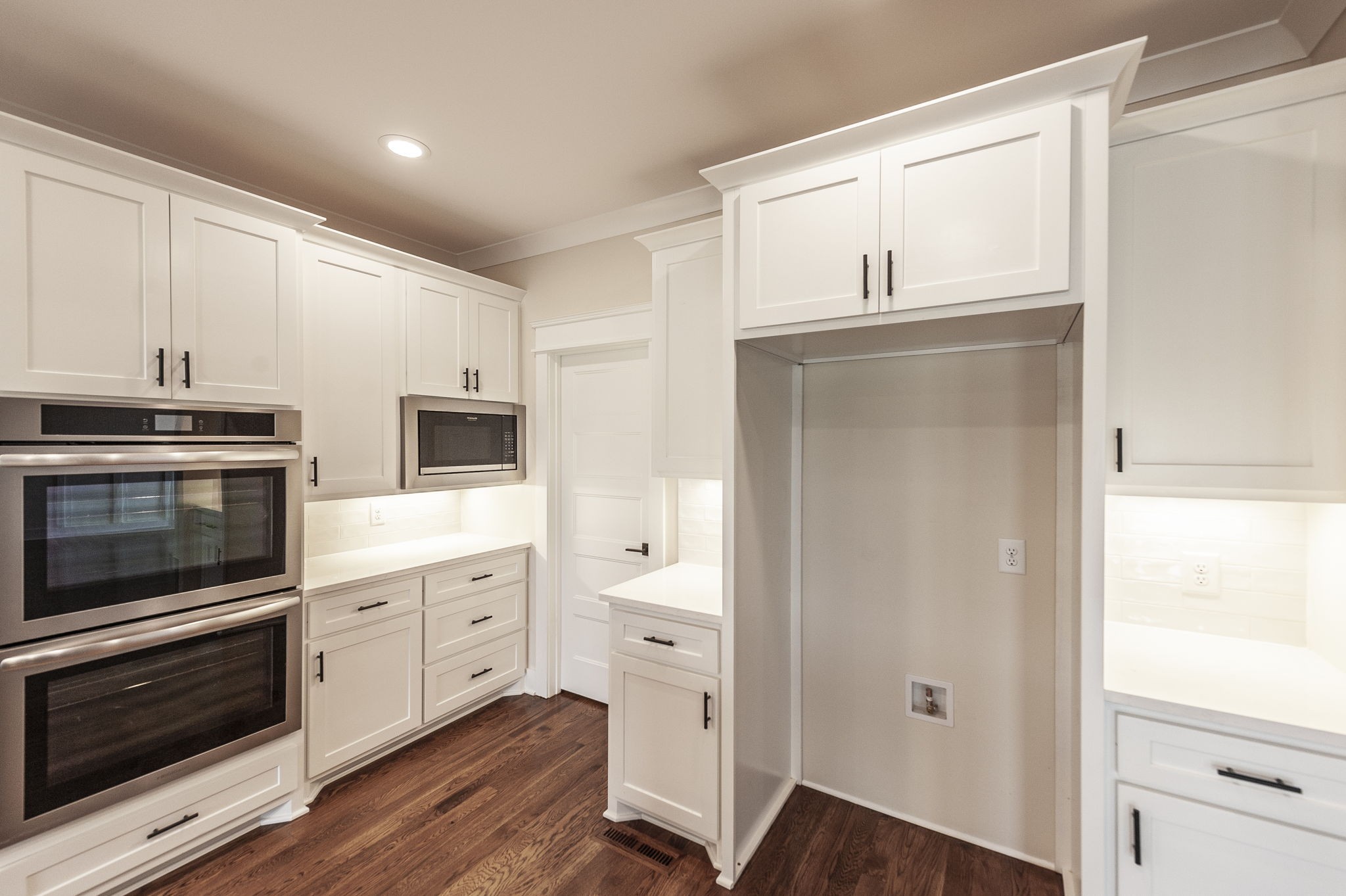 1060 Millbrook Way Gallatin, TN 37066 - Photo 27 of 79 a kitchen with cabinets stainless steel appliances and wooden floor