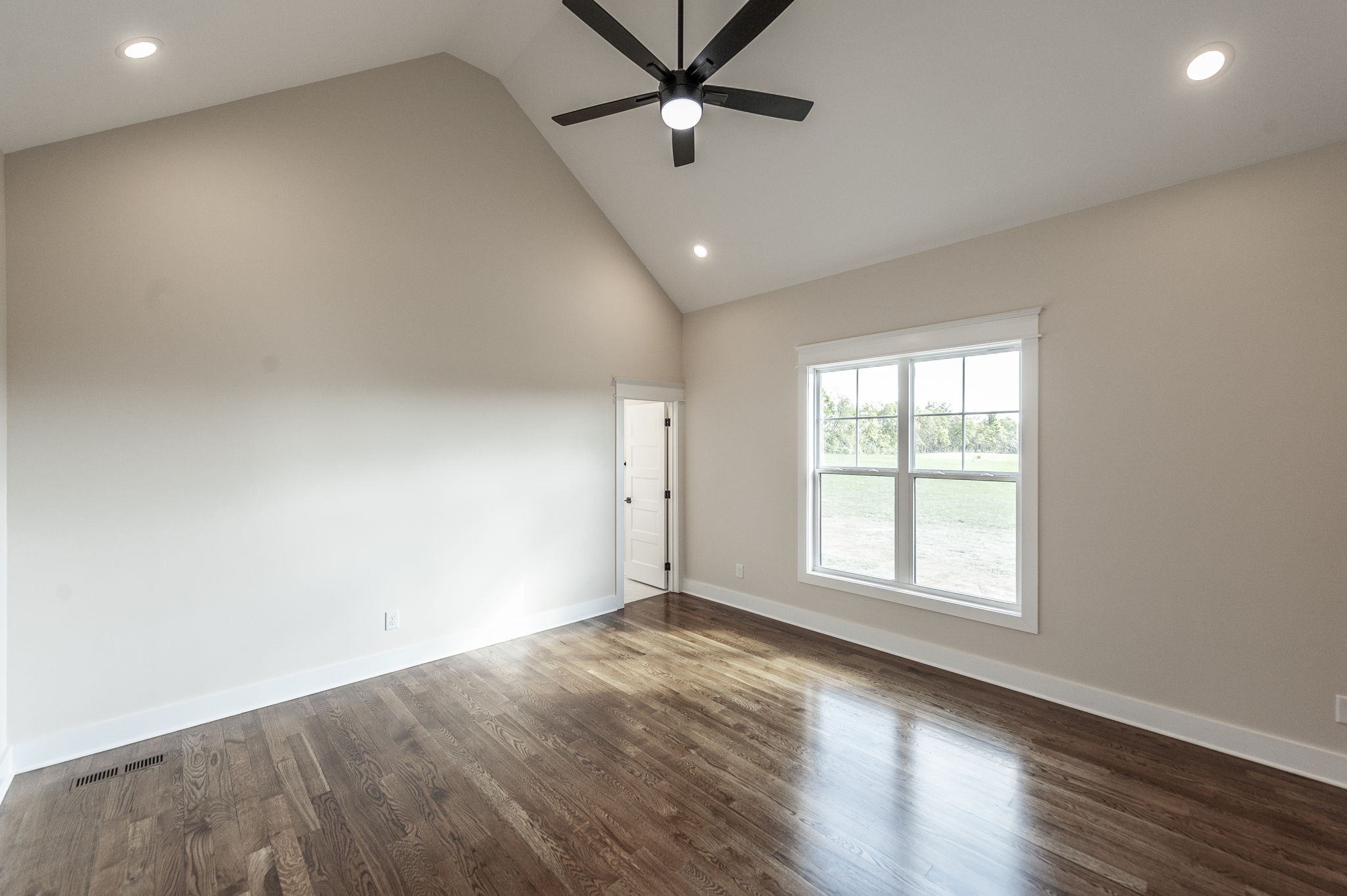 1060 Millbrook Way Gallatin, TN 37066 - Photo 33 of 79 an empty room with wooden floor fan and windows