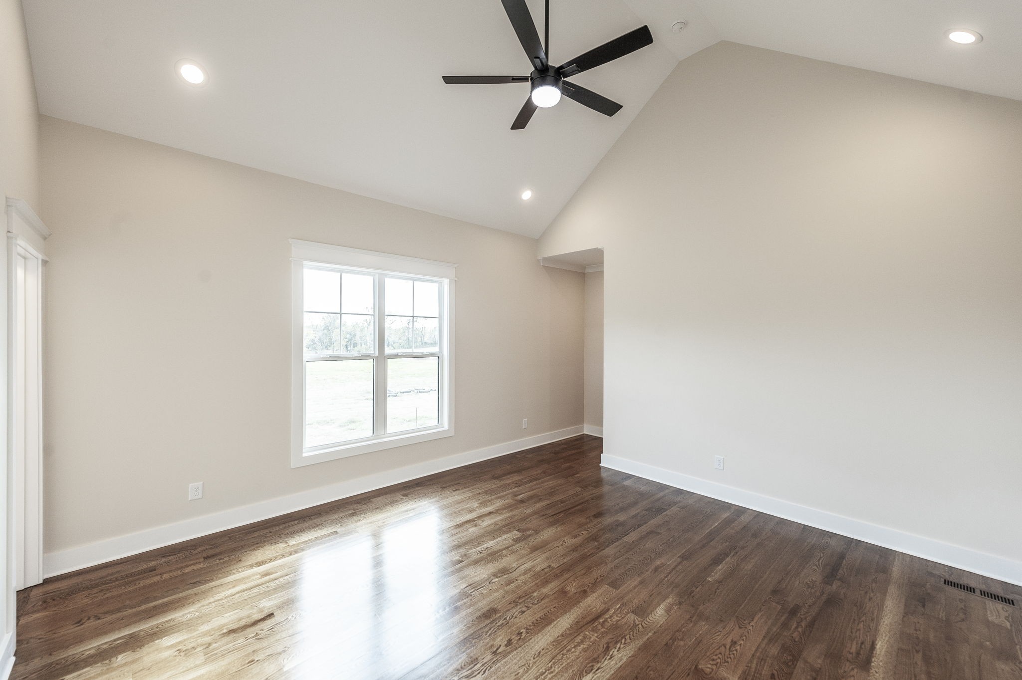1060 Millbrook Way Gallatin, TN 37066 - Photo 35 of 79 an empty room with wooden floor fan and windows