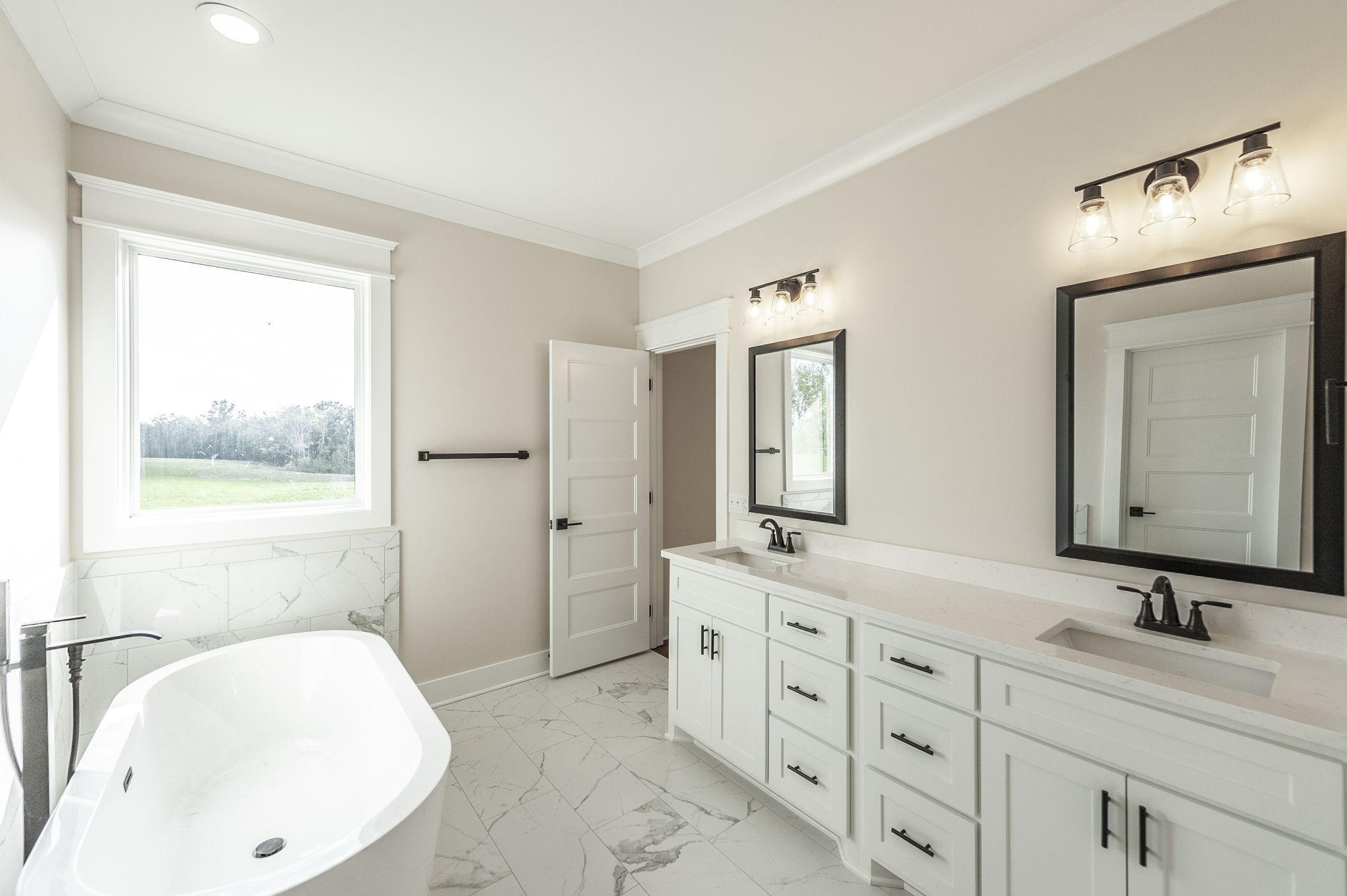 1060 Millbrook Way Gallatin, TN 37066 - Photo 40 of 79 a bathroom with a double vanity sink mirror and bathtub