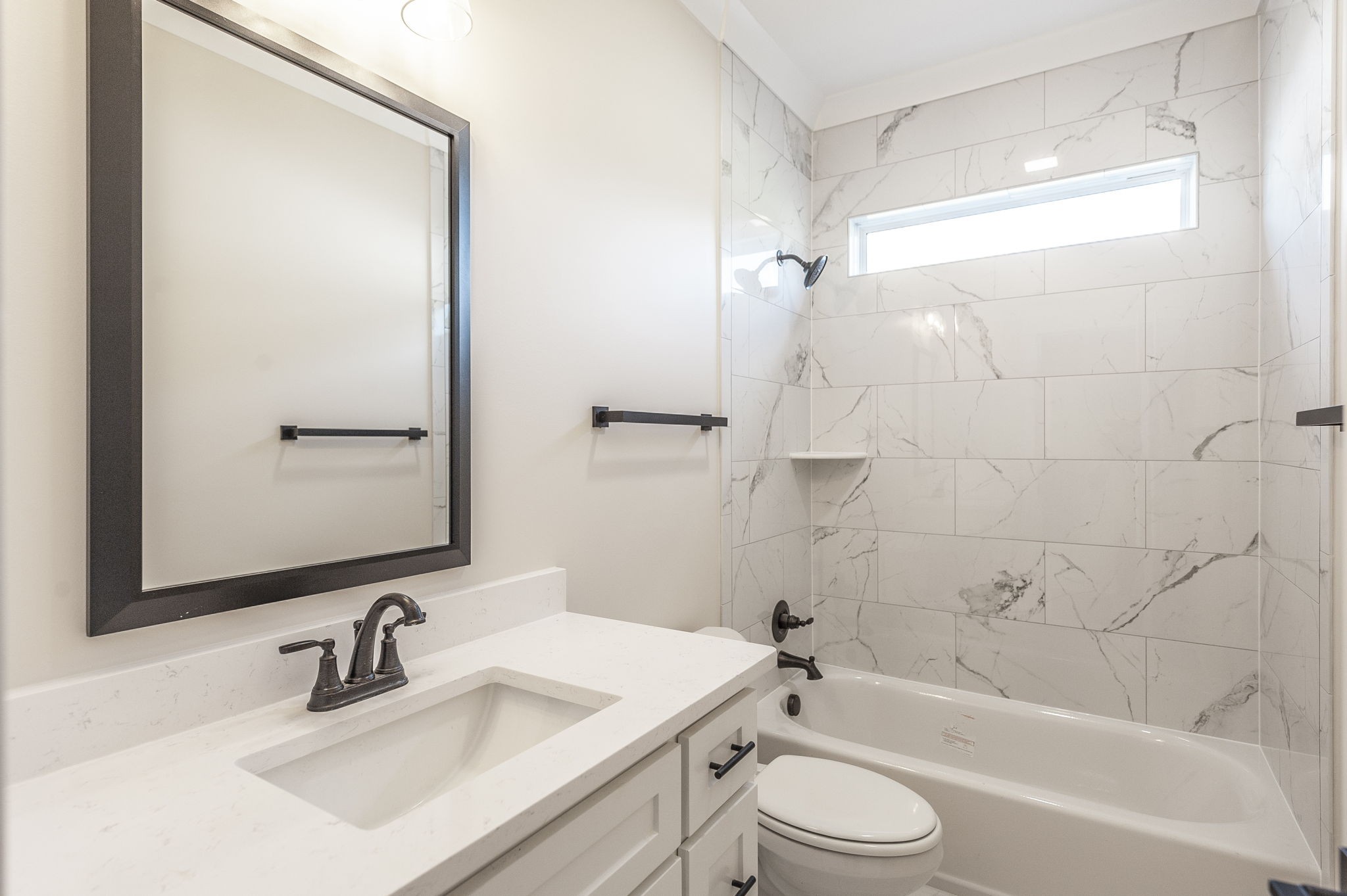 1060 Millbrook Way Gallatin, TN 37066 - Photo 52 of 79 a bathroom with a sink toilet tub and shower