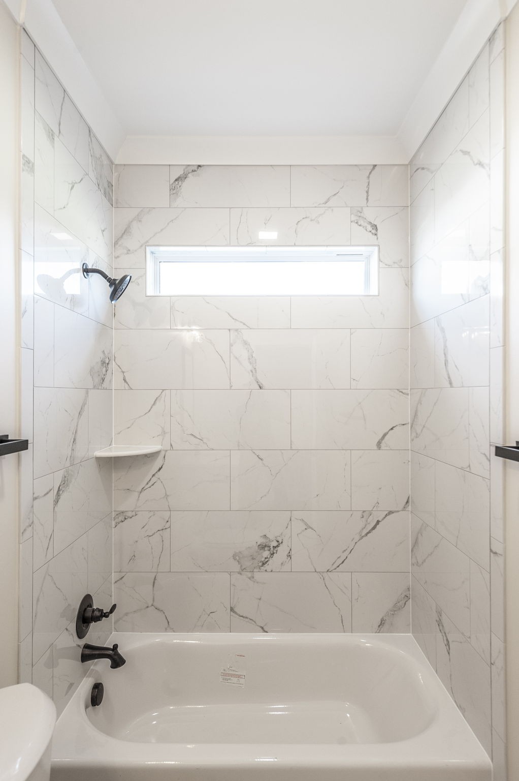 1060 Millbrook Way Gallatin, TN 37066 - Photo 53 of 79 a bathroom with a shower and a bath tub