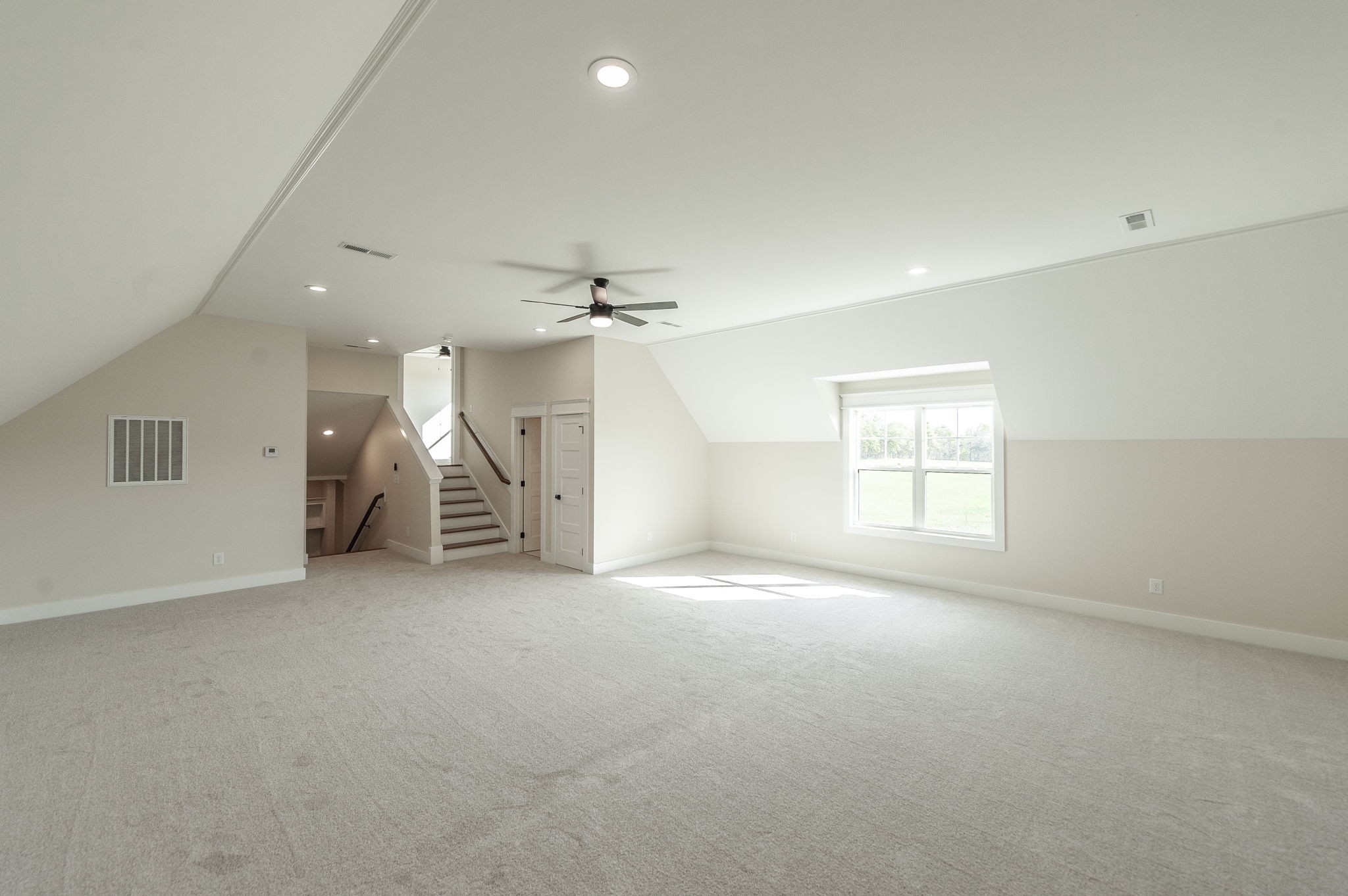 1060 Millbrook Way Gallatin, TN 37066 - Photo 59 of 79 an empty room with a window and a chandelier