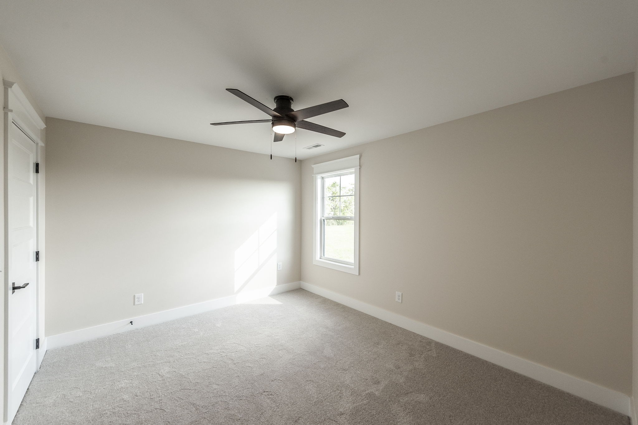 1060 Millbrook Way Gallatin, TN 37066 - Photo 65 of 79 an empty room with a window and a fan