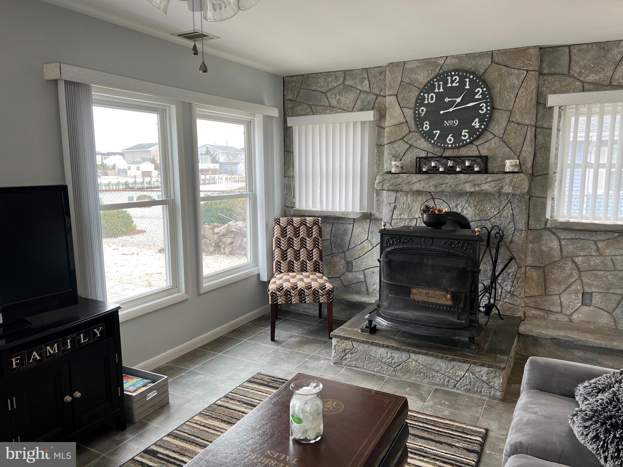 238 Montclair Road South Barnegat, NJ 08005 - Photo 8 of 19 Living Room and Wood-burning Stove